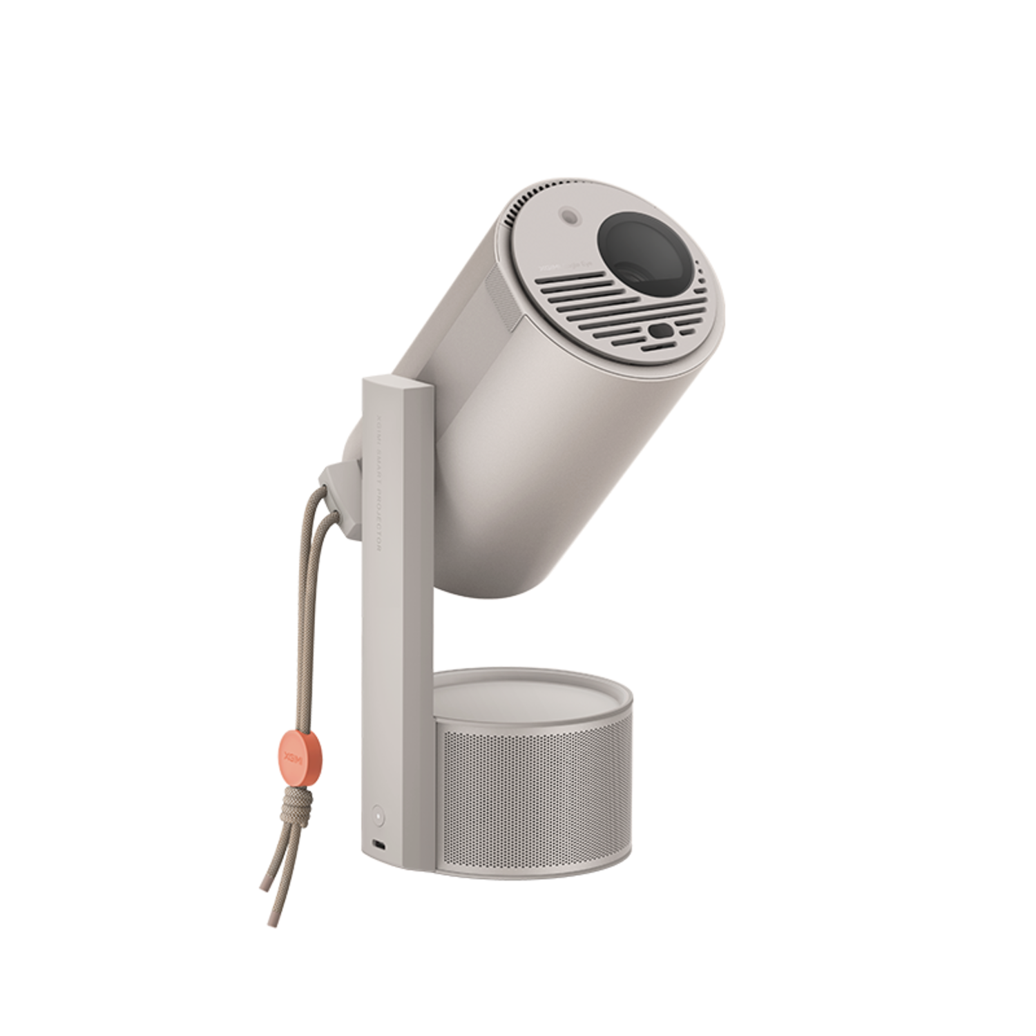 Een witte en grijze projector met een cilindrische behuizing en een cirkelvormige basis, geïsoleerd.
