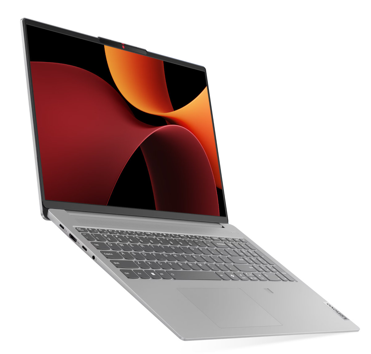 Srebrny laptop z czerwono-pomarańczowym ekranem, pod kątem na białym tle.