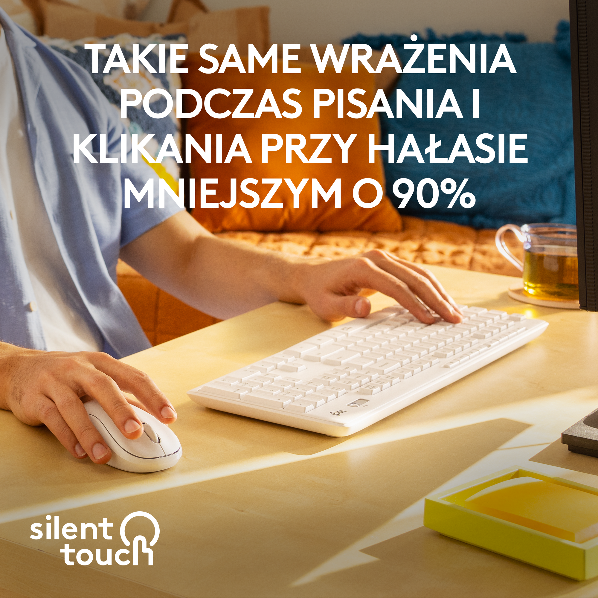 Osoba używająca białej klawiatury i myszy na biurku. Tekst: silent touch.