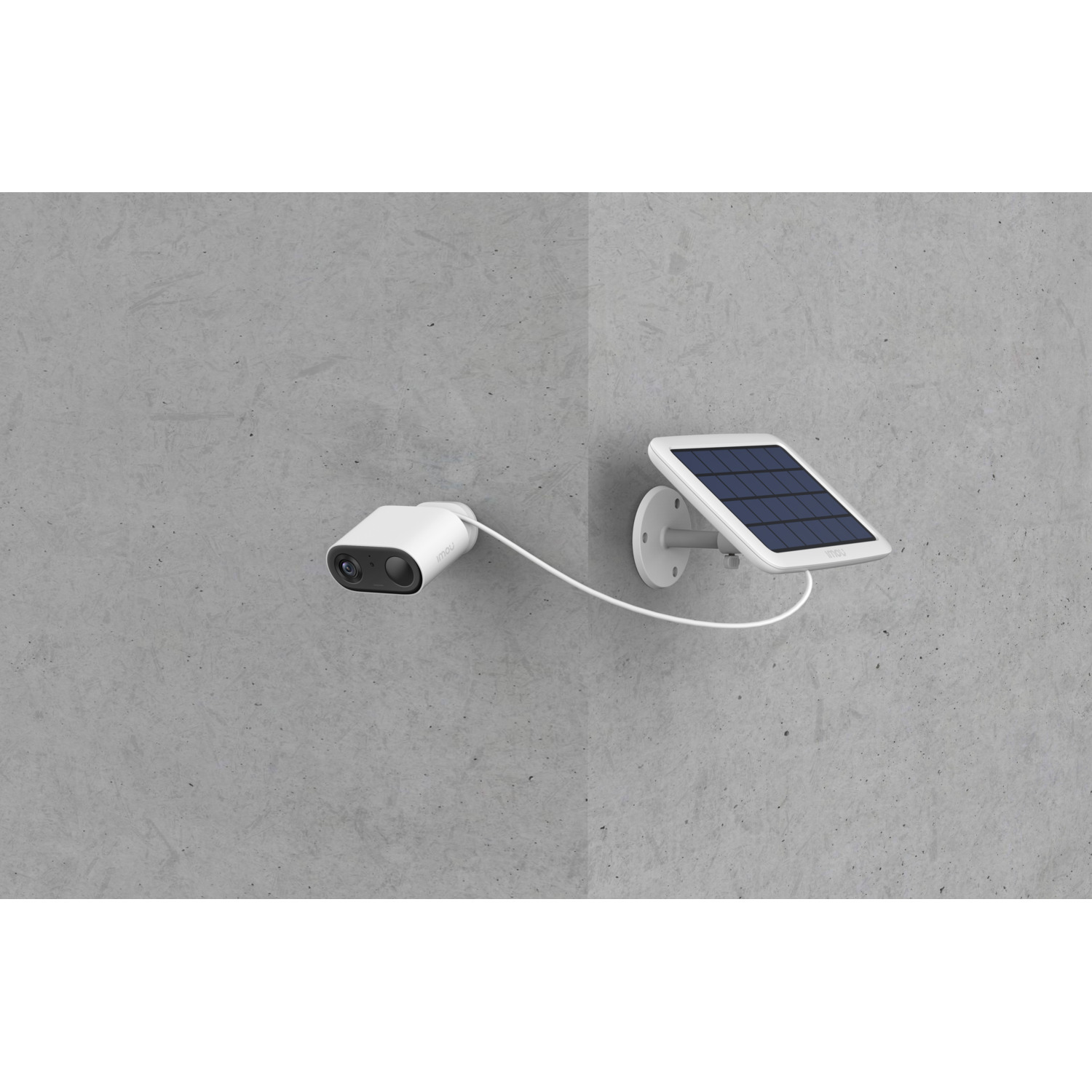 White security camera mounted on a wall, connected to a solar panel for power.
