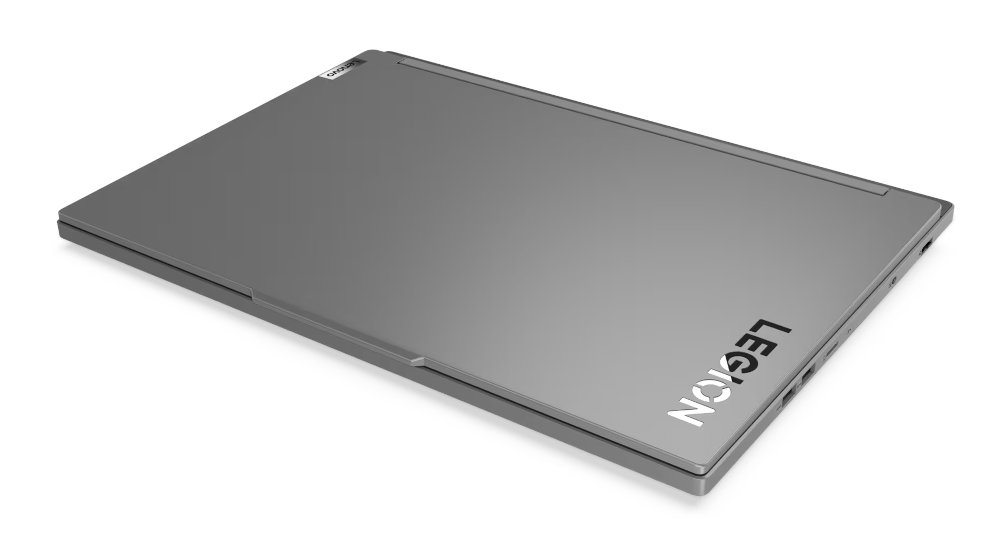 Zamknięty szary laptop z logo 'LEGION' na pokrywie, na białej powierzchni.