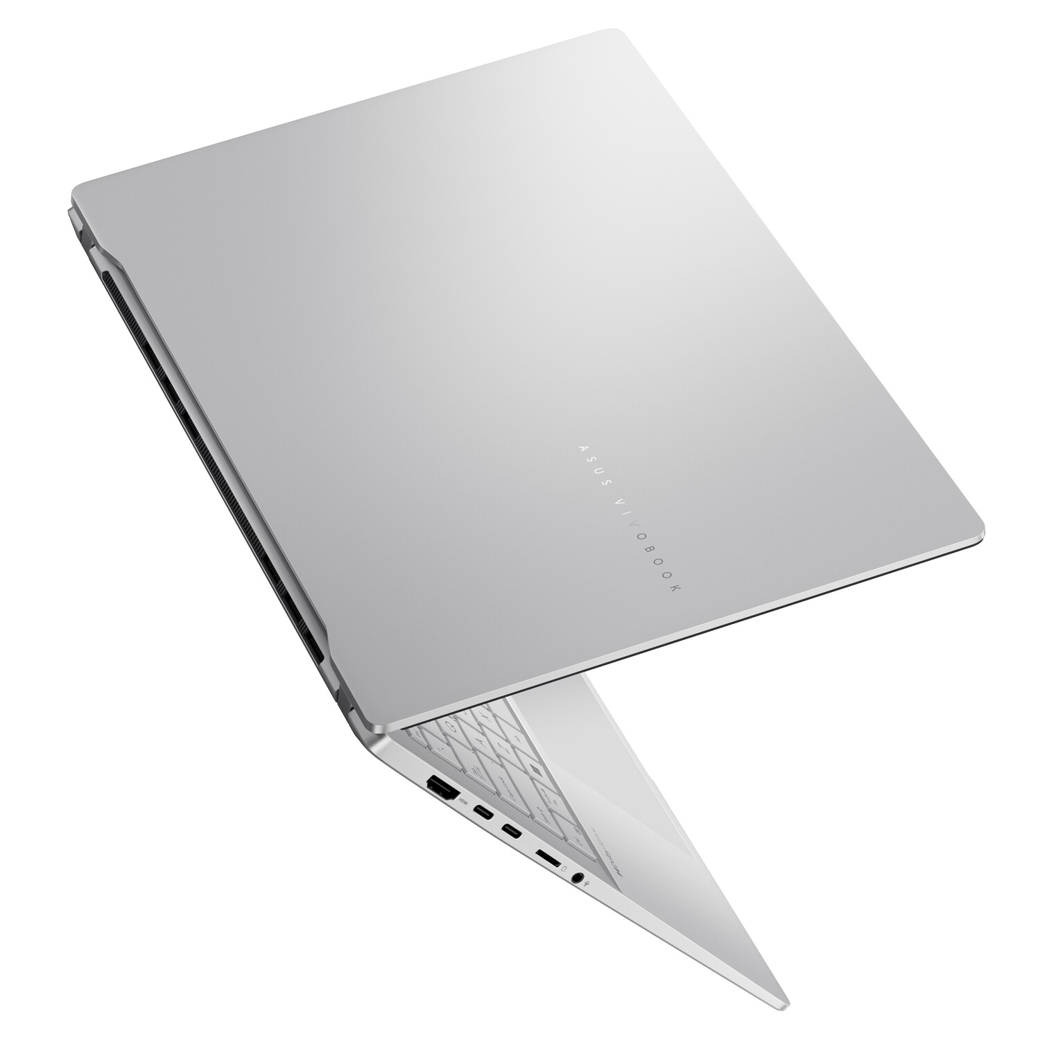 Ordinateur portable argenté, légèrement ouvert, montrant le clavier et l'intérieur de l'écran, avec le logo ASUS Vivobook.