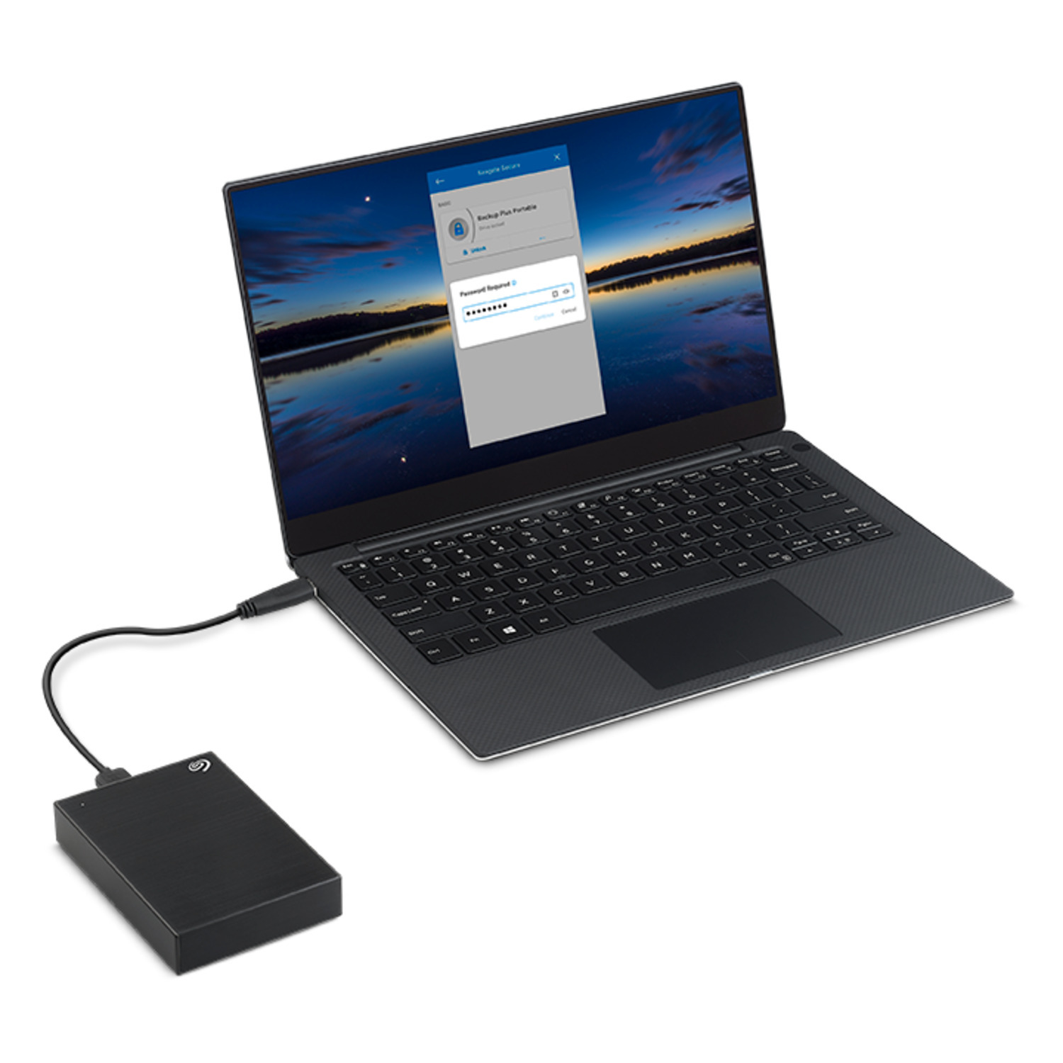 A laptop connected to a black external hard drive by a cable.