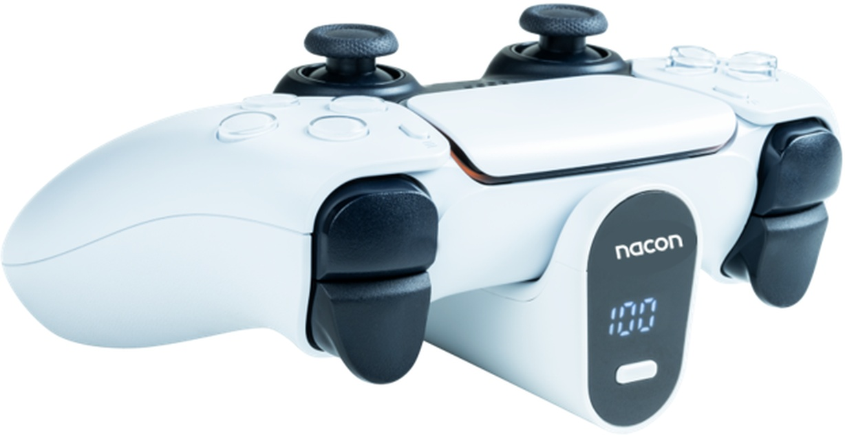 Une manette blanche et noire avec deux joysticks sur une base blanche et un affichage numérique.