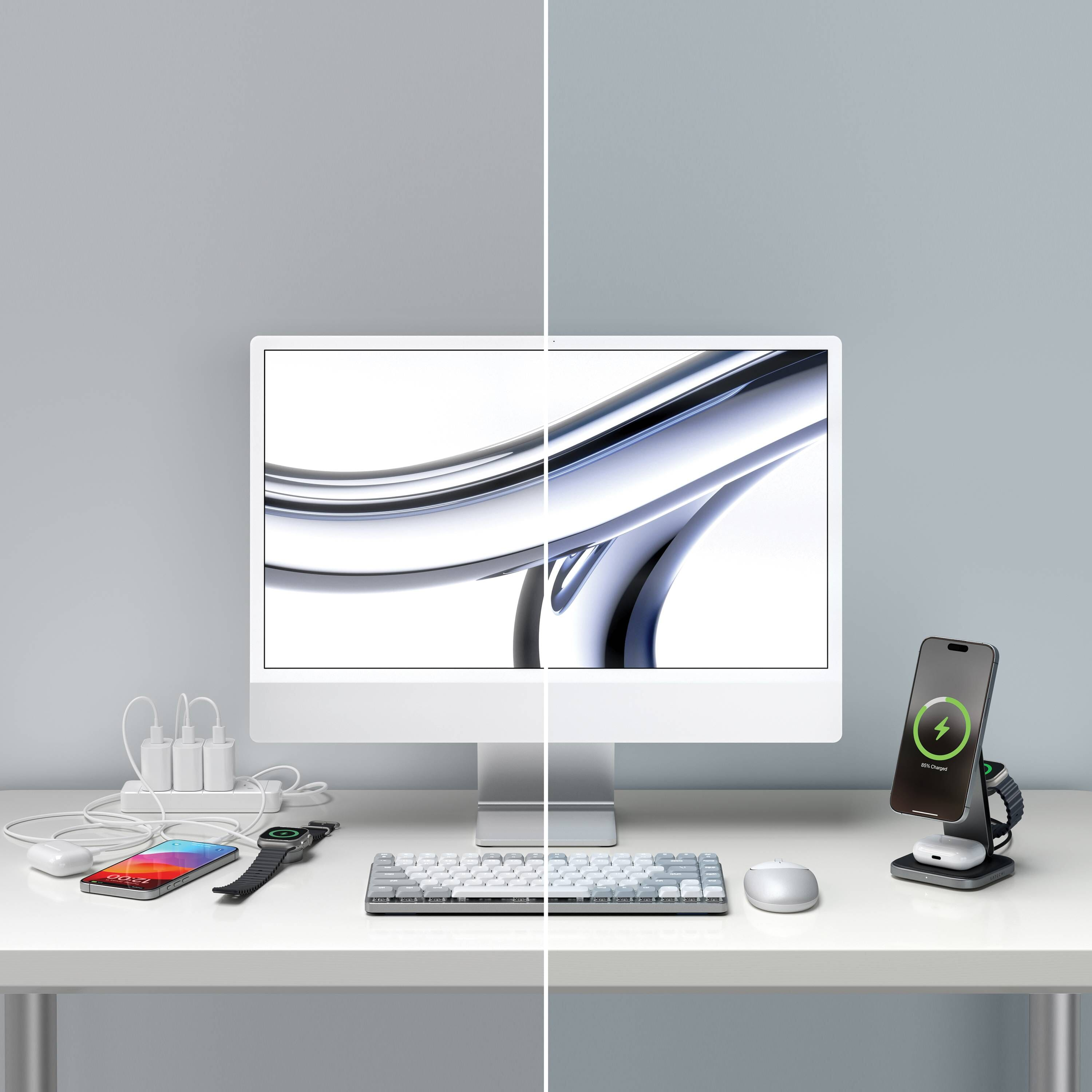 Configuration de bureau : Moniteur, clavier, souris, chargeur de téléphone et chargeur de montre connectée. Blanc et argent.