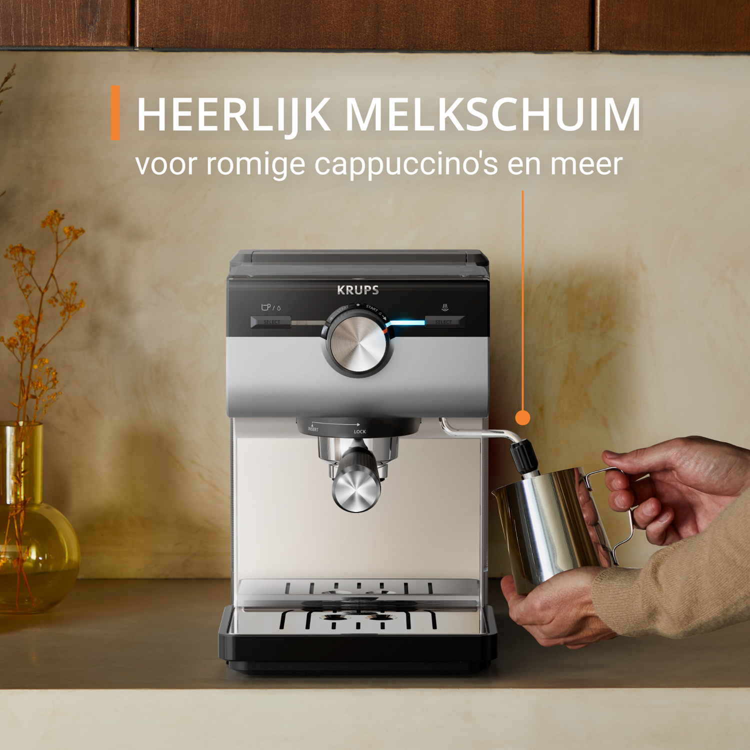 A silver and black espresso machine with a milk frothing pitcher and text in Dutch.