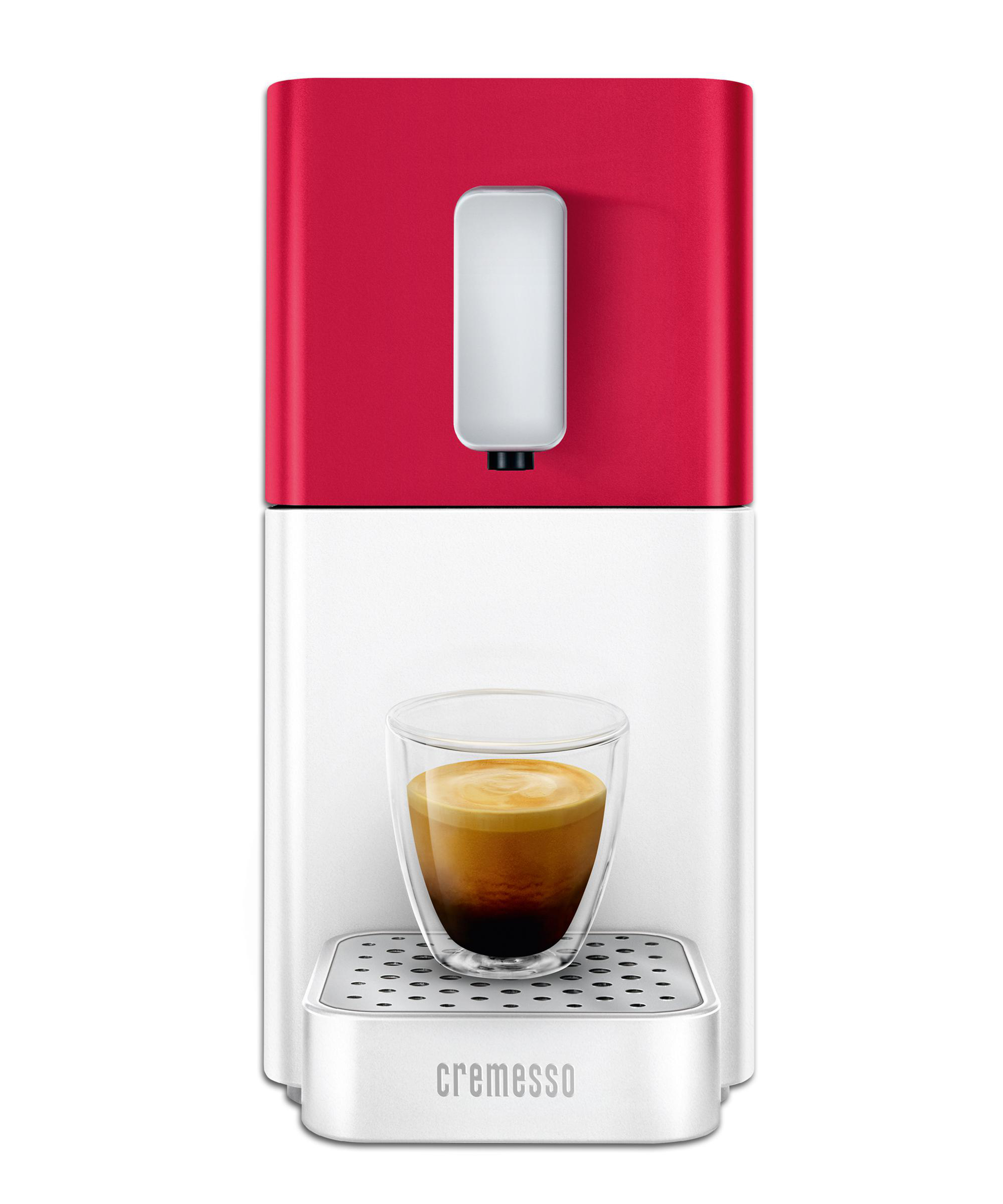 Eine rot-weiße Cremesso-Kaffeemaschine, die Kaffee in ein Glas abfüllt.