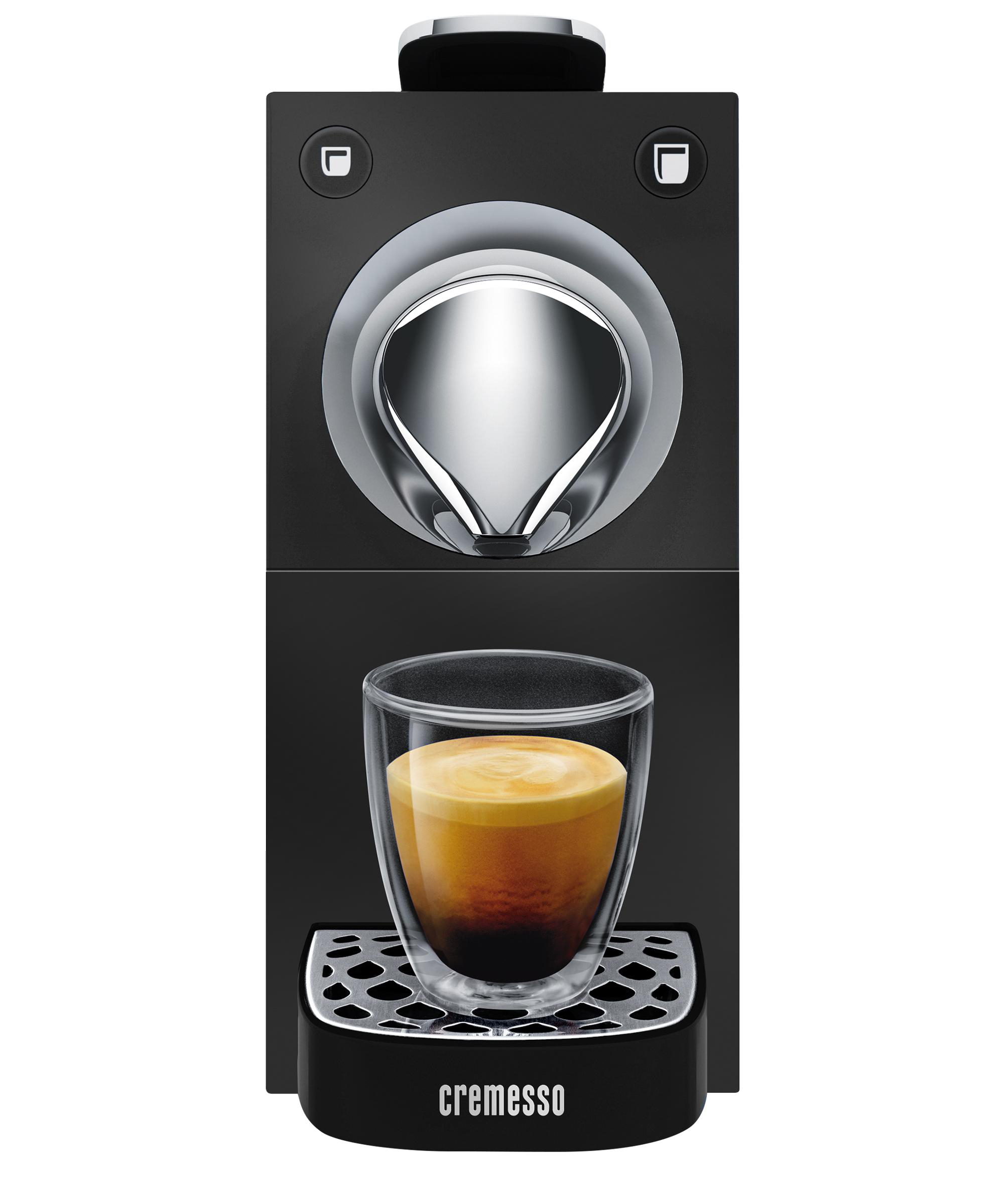 Nahaufnahme einer schwarzen und silbernen Espressomaschine mit einem Glas Kaffee.