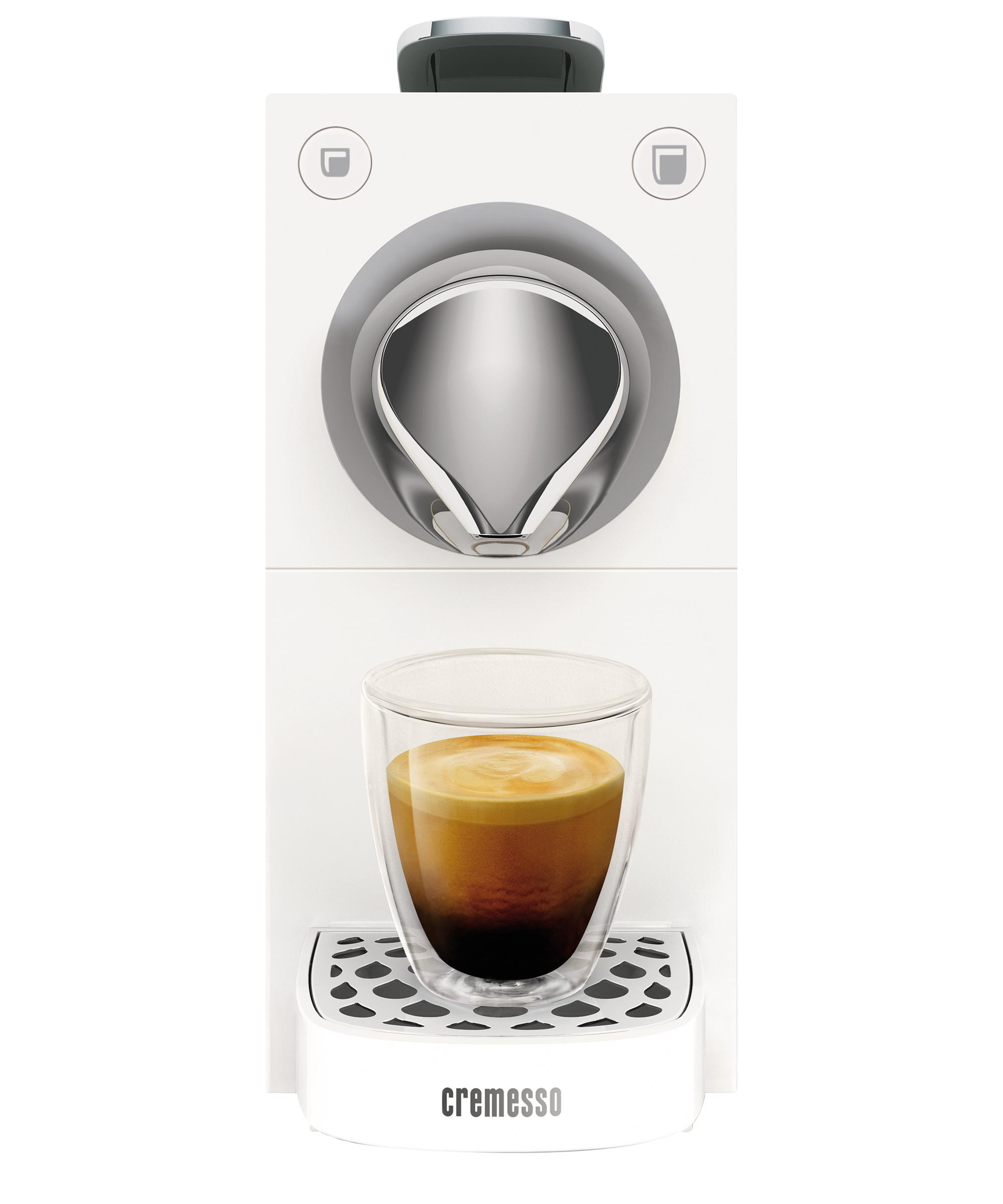Eine weiße Kaffeemaschine mit einem Glas Kaffee unter dem Ausguss.