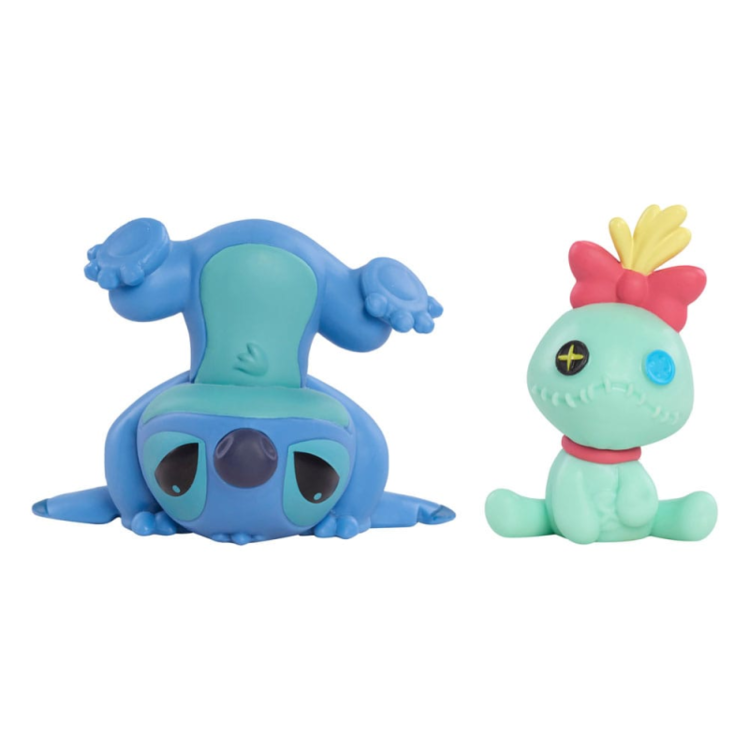 Two small Stitch dolls, one upside down, and the other upright.