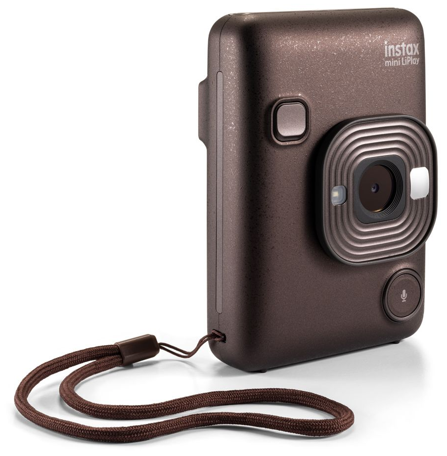 Barna Instax kamera csuklópánttal, oldalnézet.