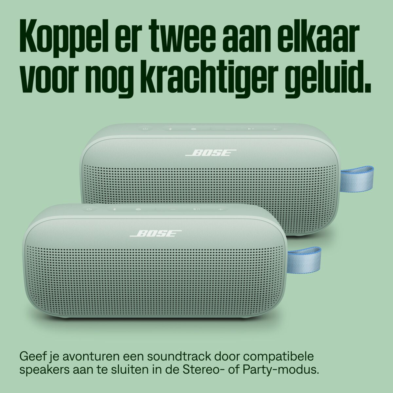 Two light green BOSE speakers on a light green background.