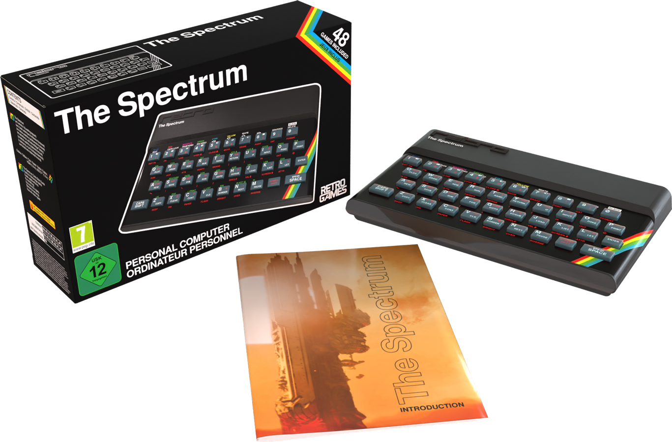 Ein Retro-Computer 'The Spectrum' mit Box, Bedienungsanleitung und Tastatur auf weißer Oberfläche.