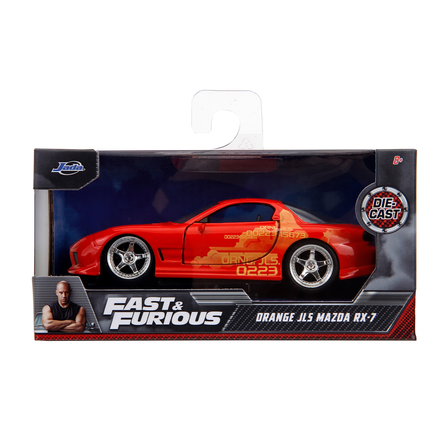 Un'auto giocattolo rossa in una scatola. L'auto è etichettata 'Orange' e 'Fast & Furious'.