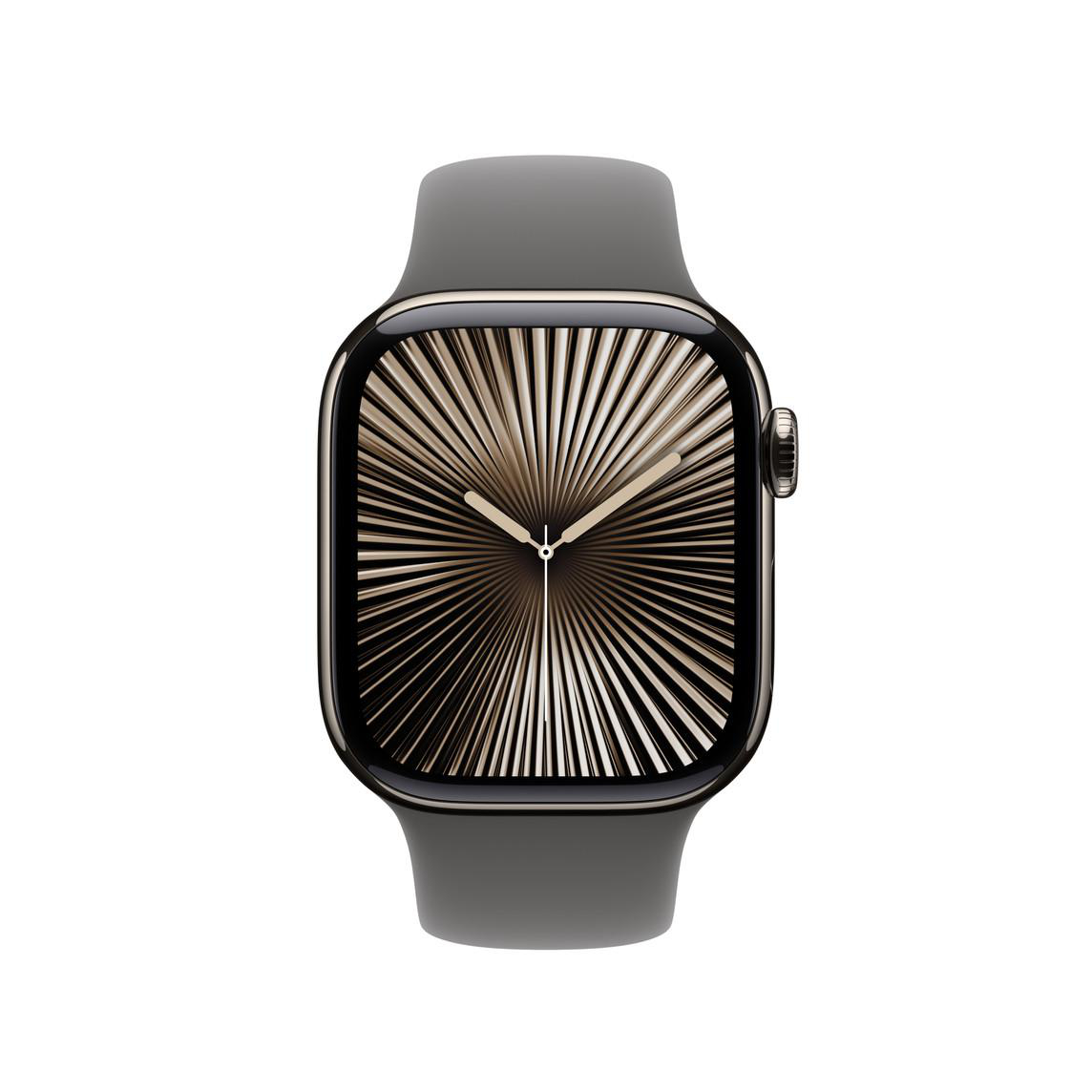 Eine dunkelgraue Apple Watch mit sonnenstrahlähnlicher Anzeige auf einem grauen Armband.
