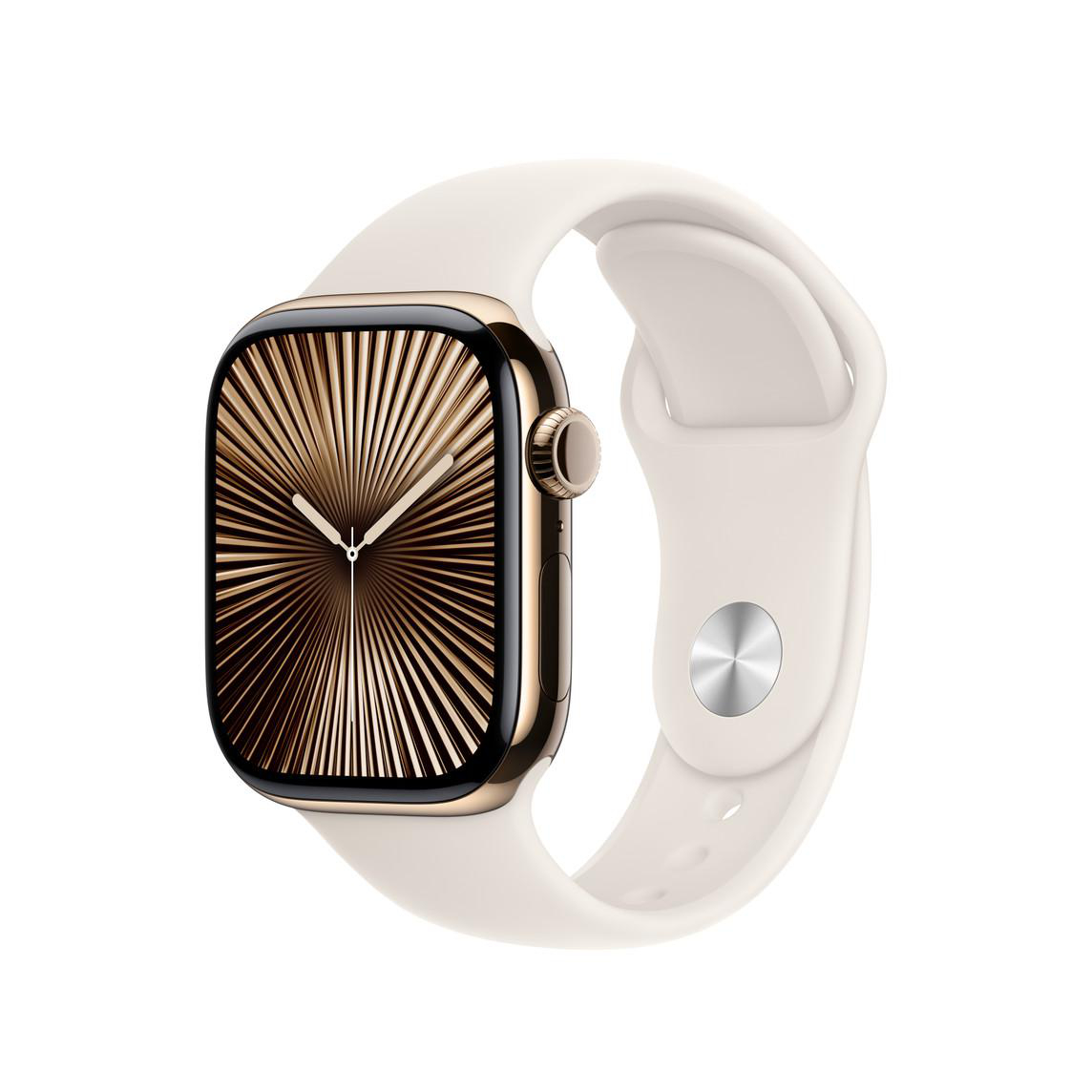 Eine Apple Watch mit goldfarbenem Gehäuse und weißem Armband vor weißem Hintergrund.
