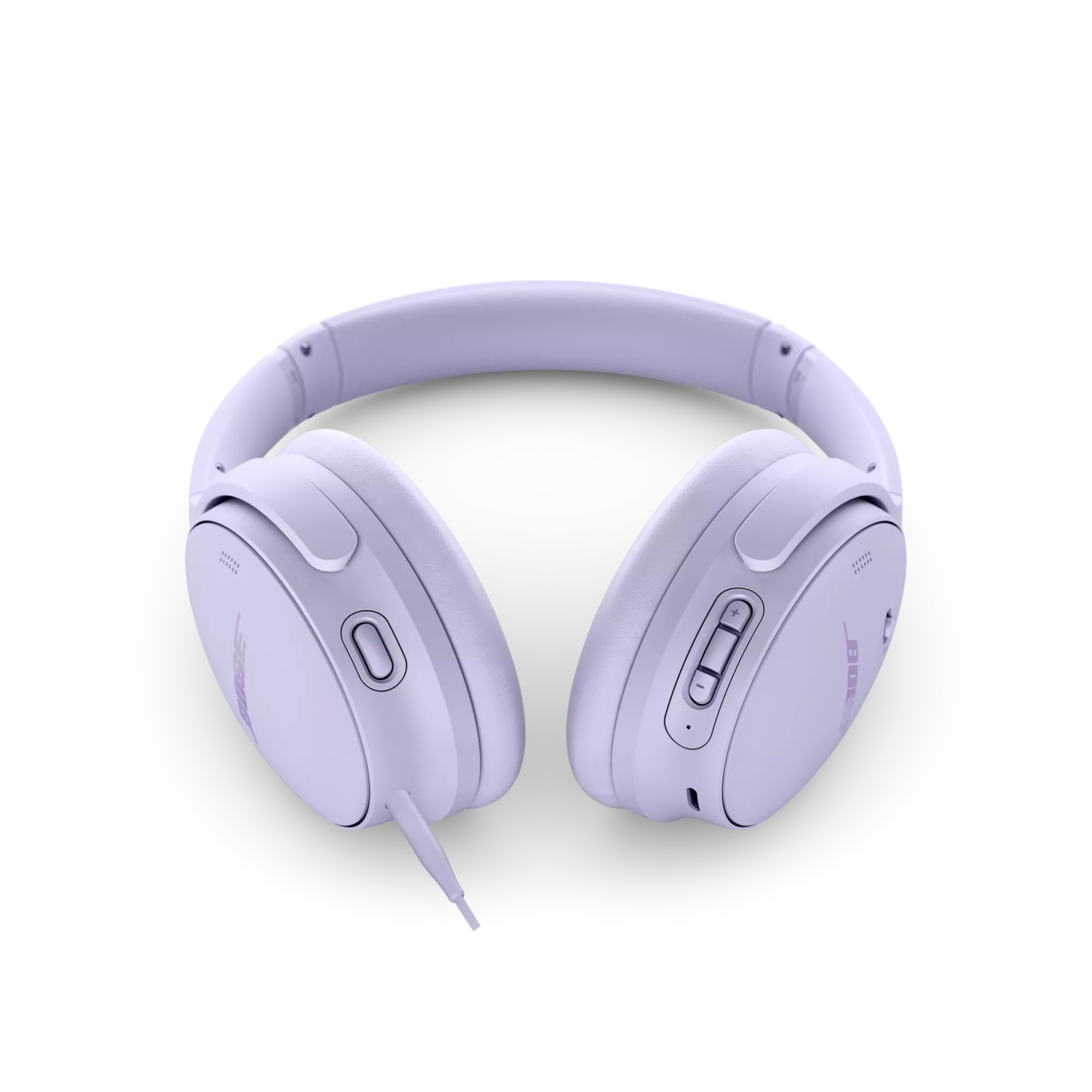 Lavender headphones on a black background. They have a headband and ear cups.