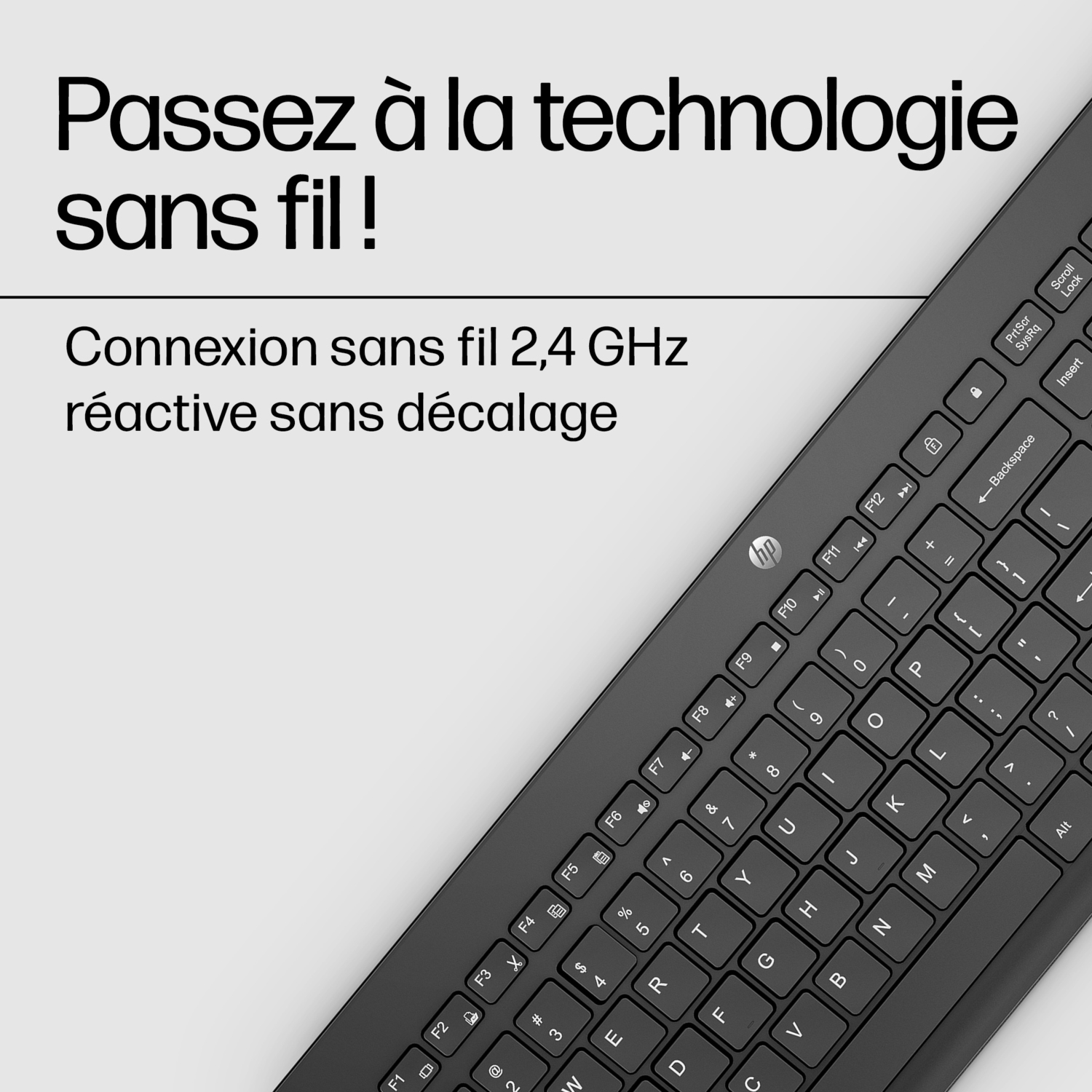 Clavier noir. Le texte ci-dessus est en français. Connexion sans fil 2,4 GHz.