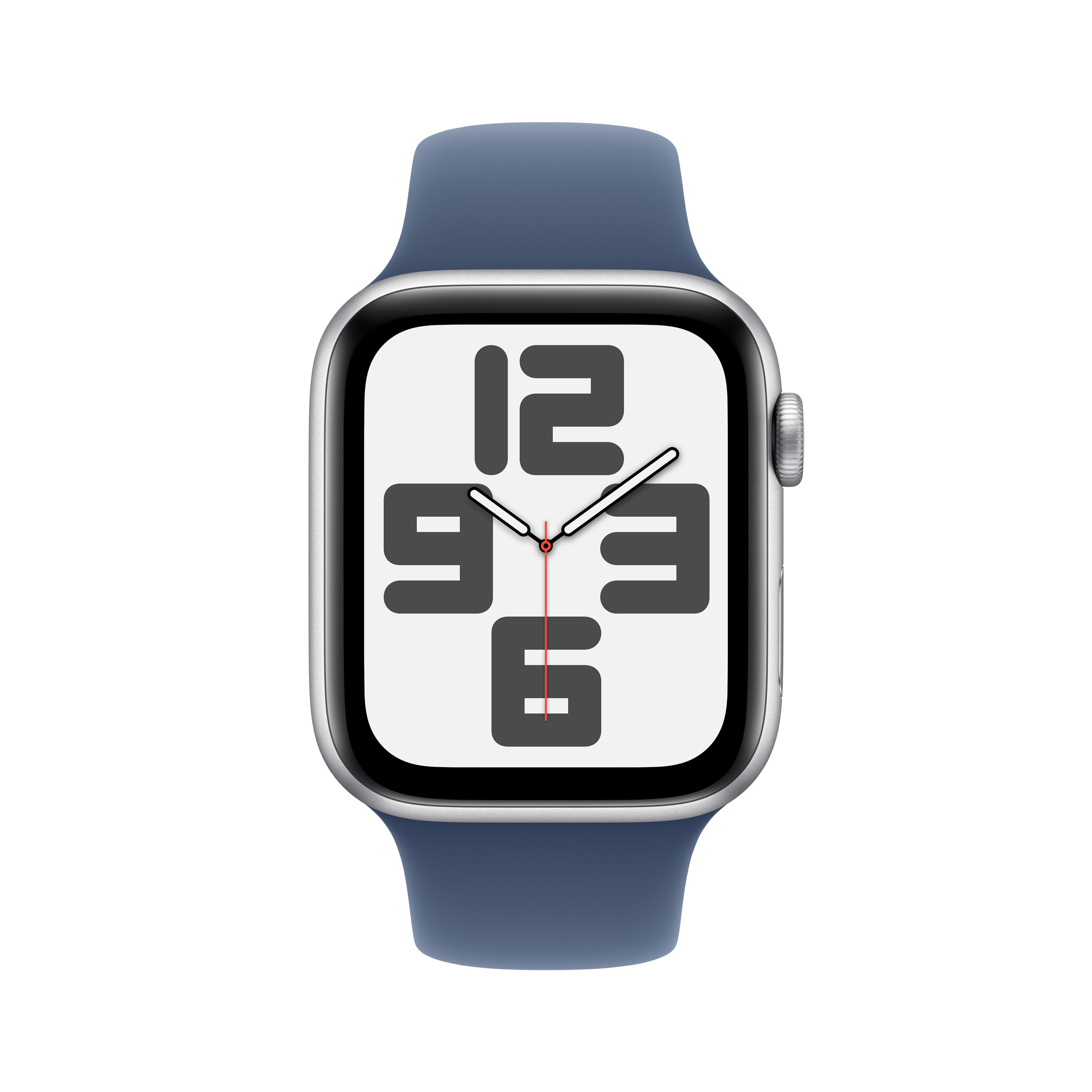 Apple Watch mit blauem Armband, zeigt die Uhrzeit 12:03. Das Zifferblatt hat große Zahlen.