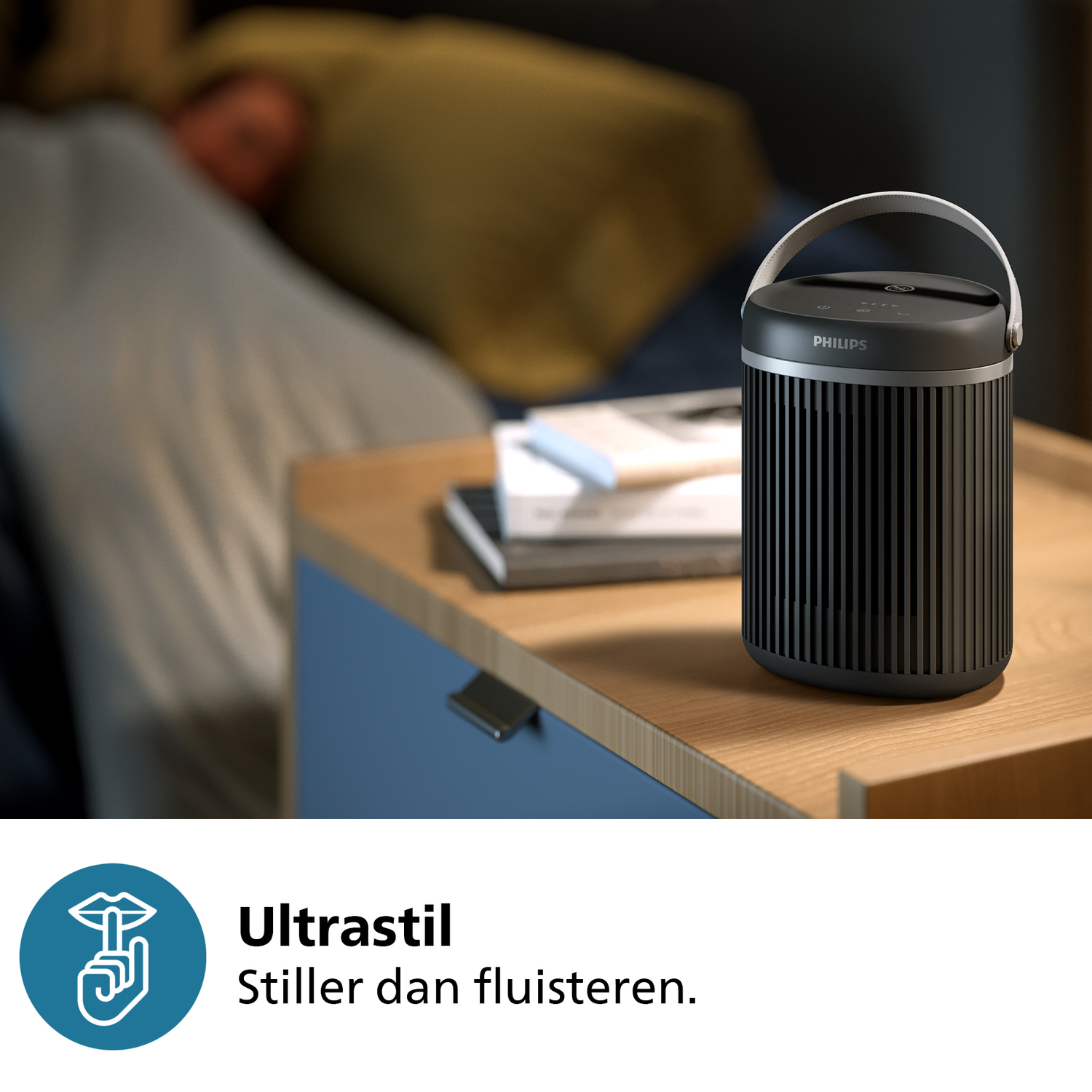 Philips air purifier with handle on a blue and wood nightstand.