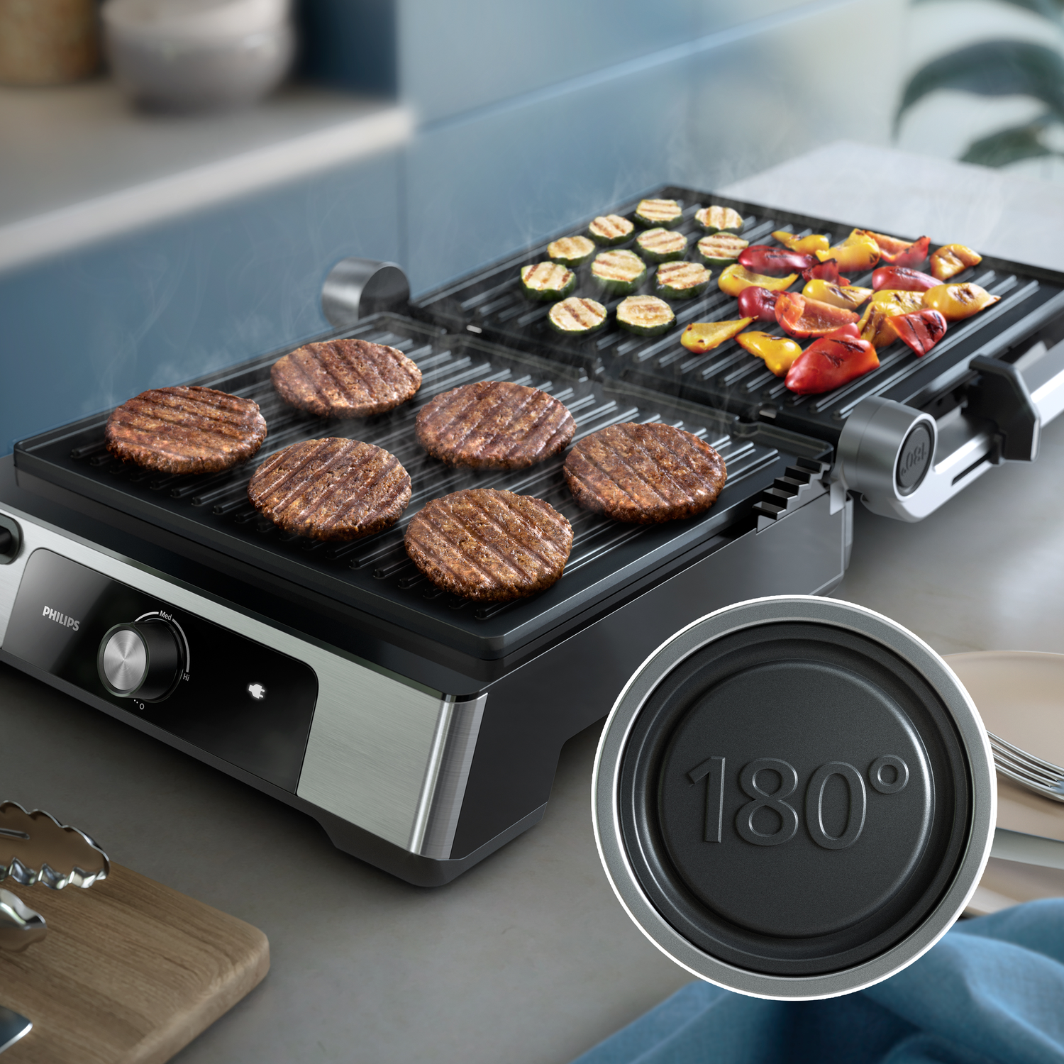 A Philips grill with burgers and grilled vegetables.