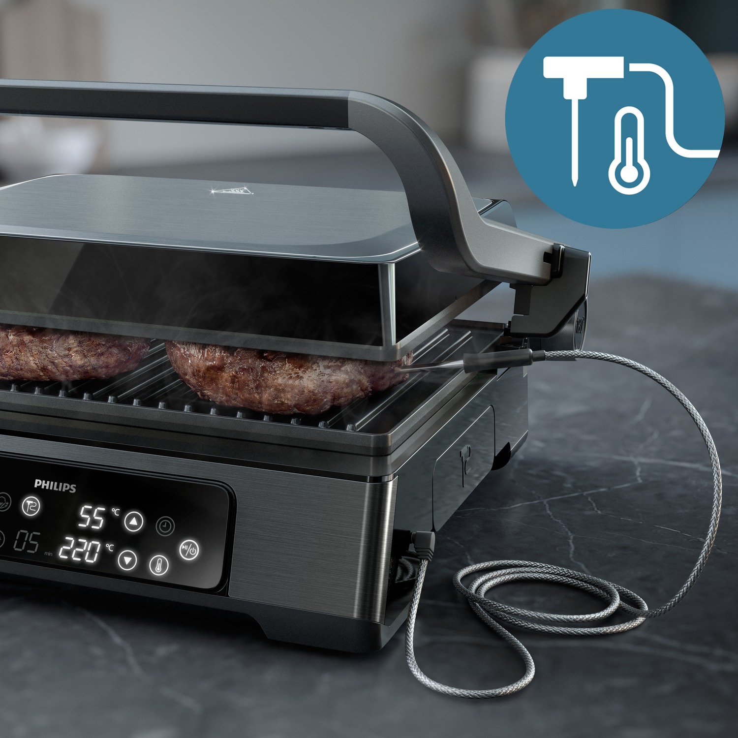 A Philips electric grill with burgers cooking. A temperature probe is connected. Digital display shows temperature and time settings.