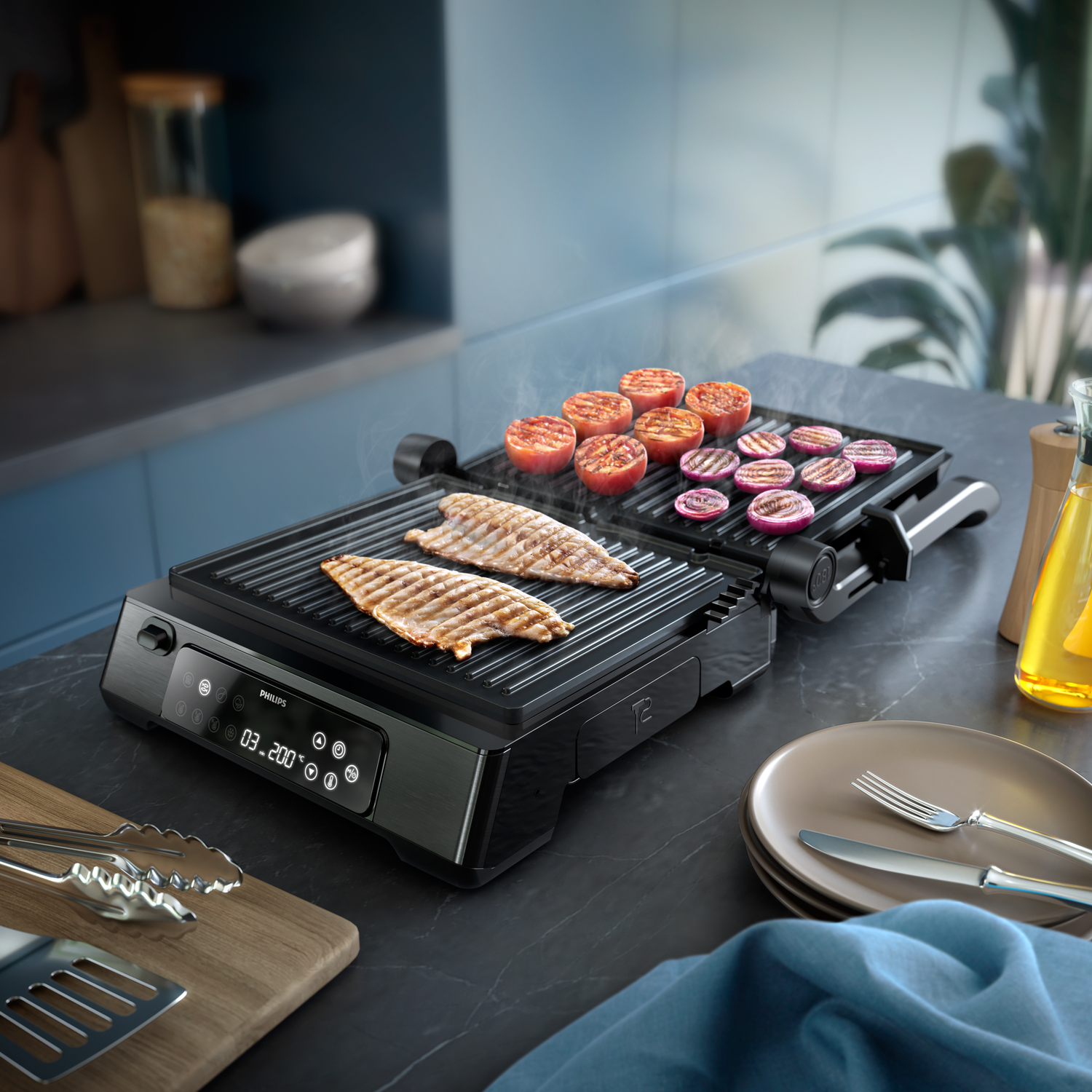 Black electric grill with grilled food: steak, tomatoes, and red onions. Set on a dark countertop.