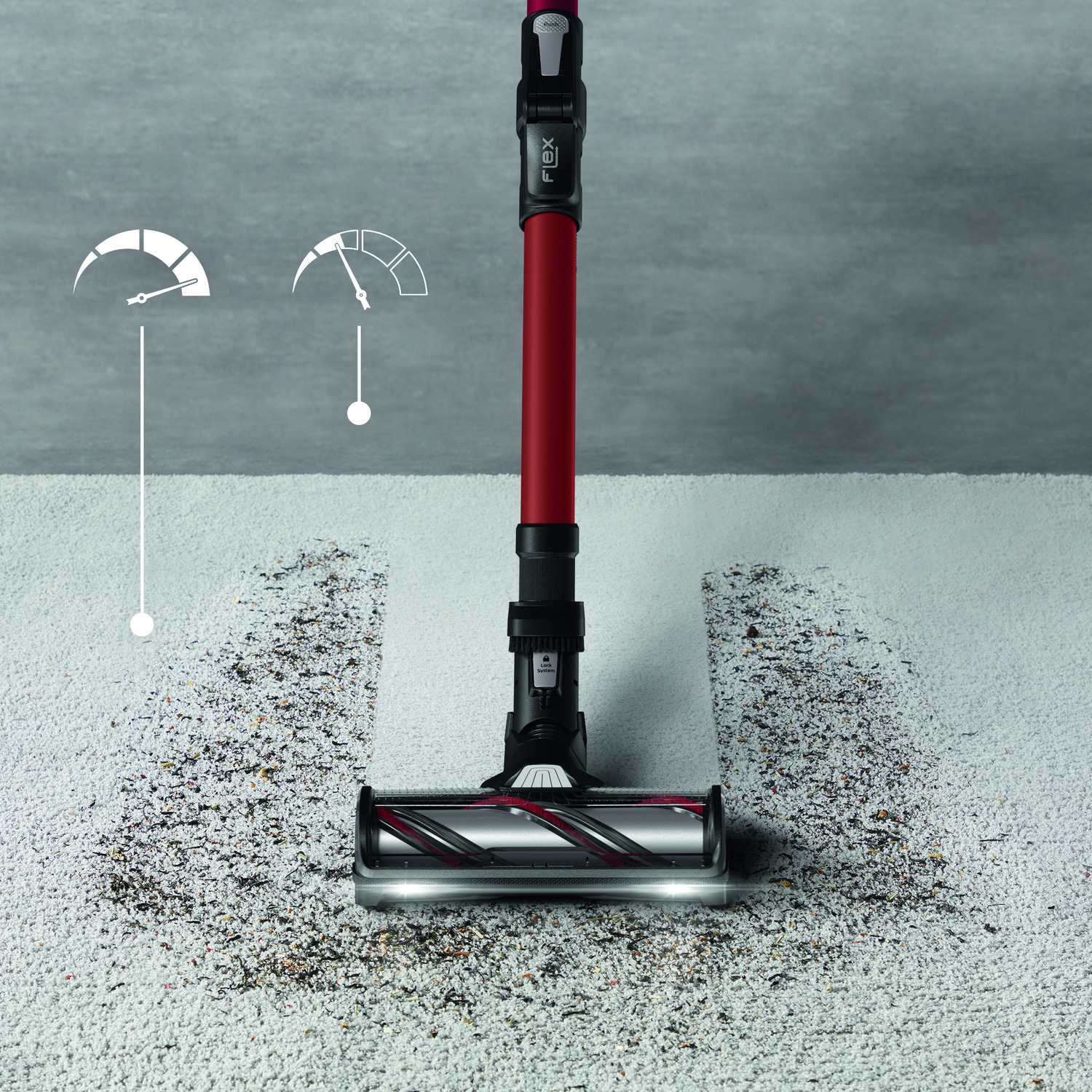 Vacuum cleaner cleaning a white carpet, showing a cleaned path.