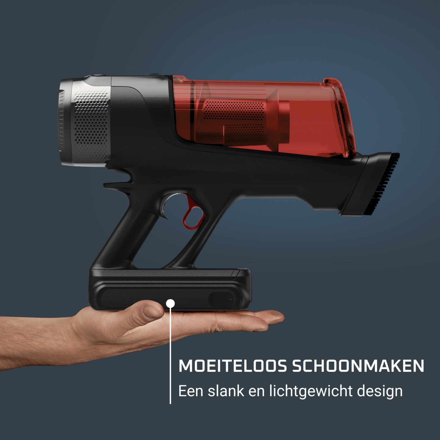 A cordless vacuum cleaner is held in a hand. The vacuum is black and red.