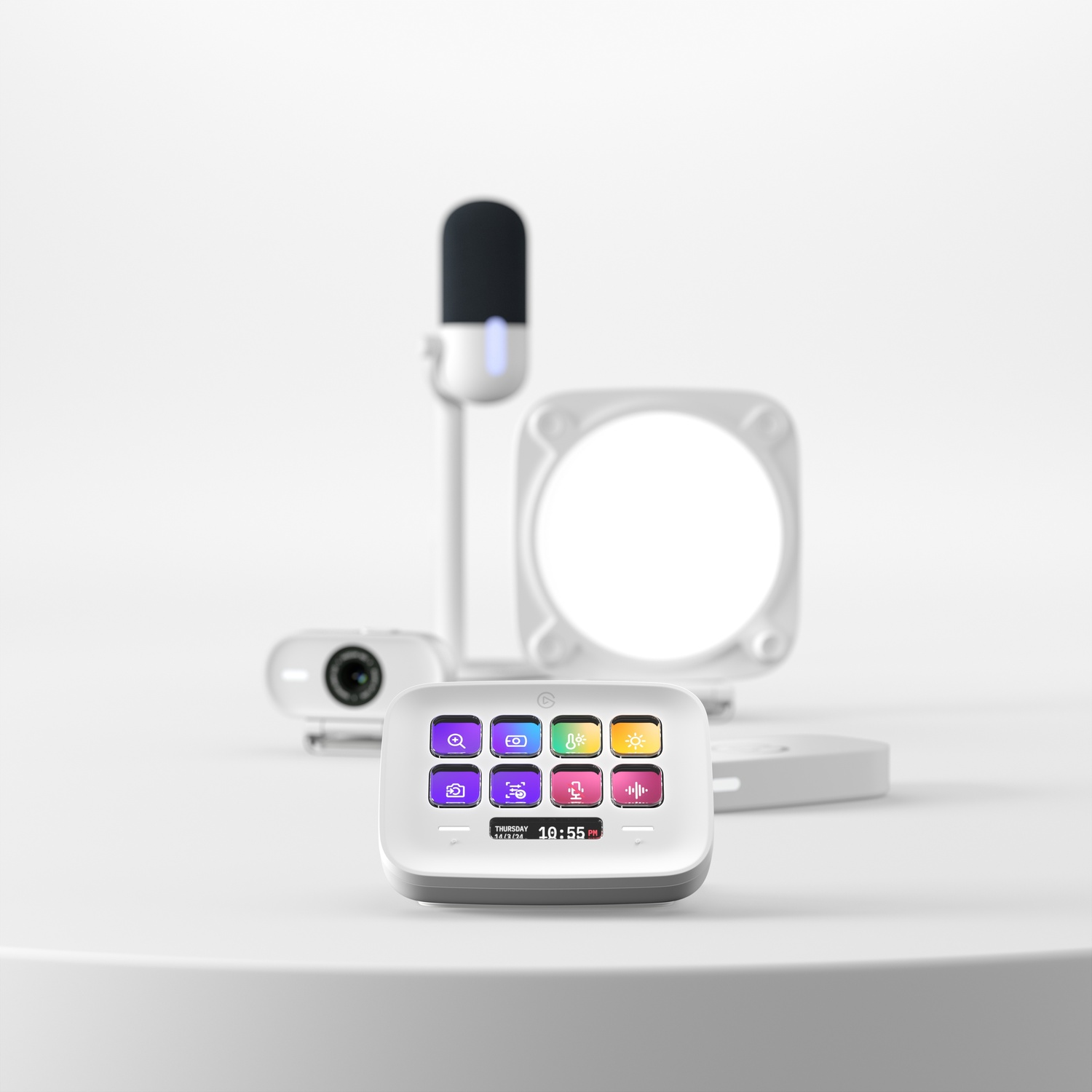 A set of white streaming equipment: a microphone, camera, light, and control panel.