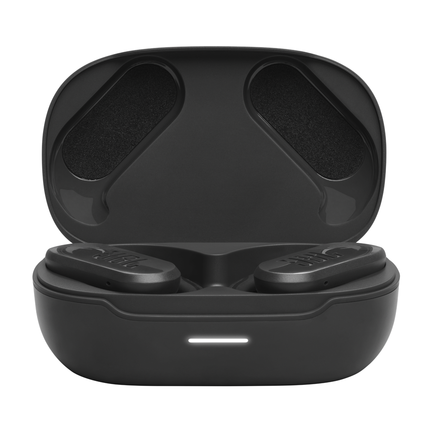 Zwarte JBL oordopjes in een open zwarte oplaadcase. De case bevindt zich in een donkere omgeving.