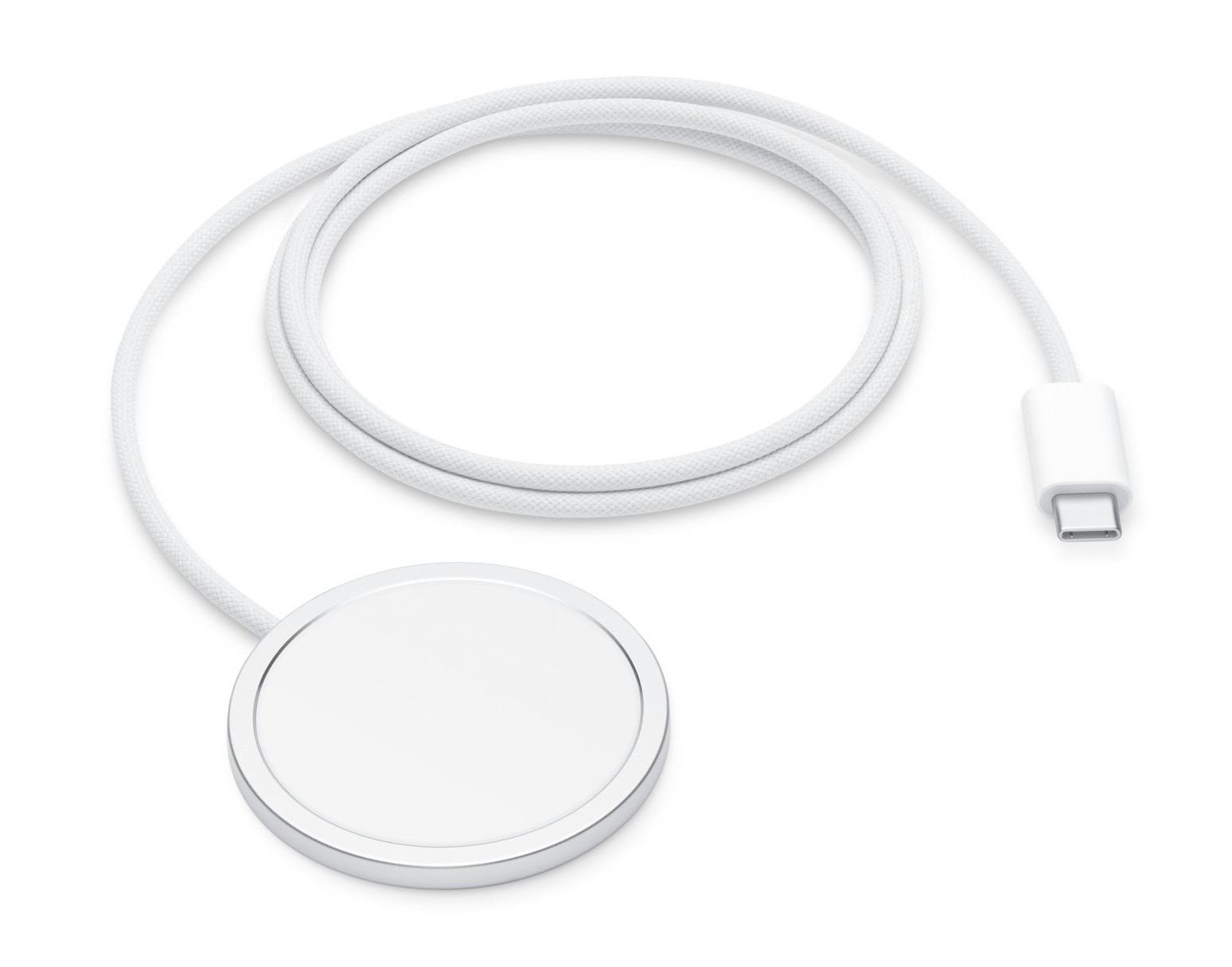 Biała magnetyczna ładowarka Apple i biały kabel USB-C. Ładowarka jest okrągła.