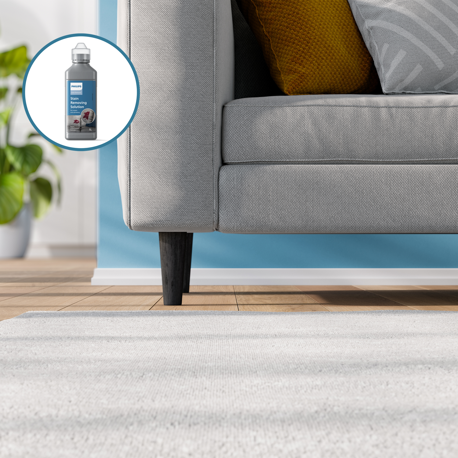 A stain removing solution bottle is shown. A gray sofa with a yellow pillow is in the background.