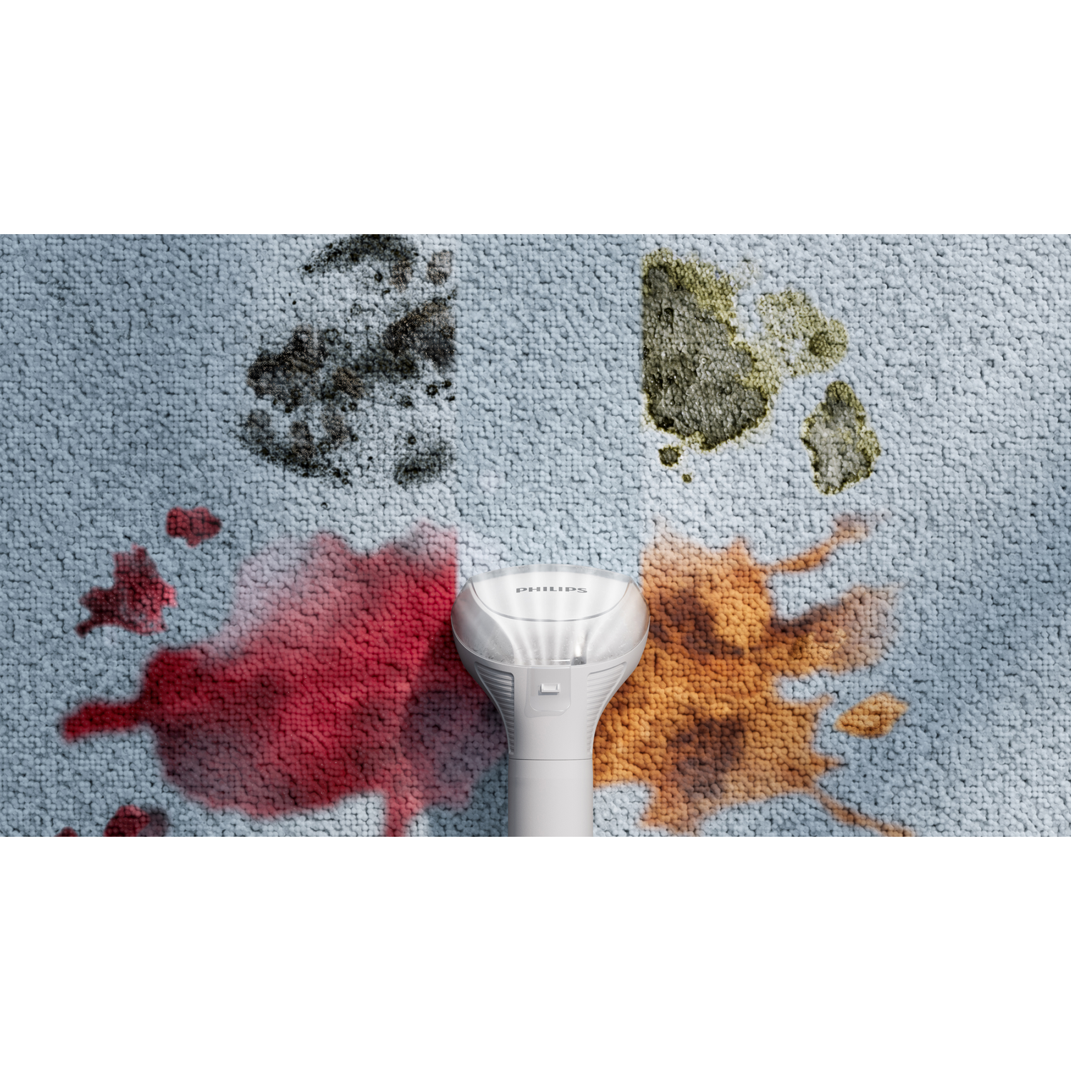 Stains of various colors on a light blue carpet, dryer in middle.