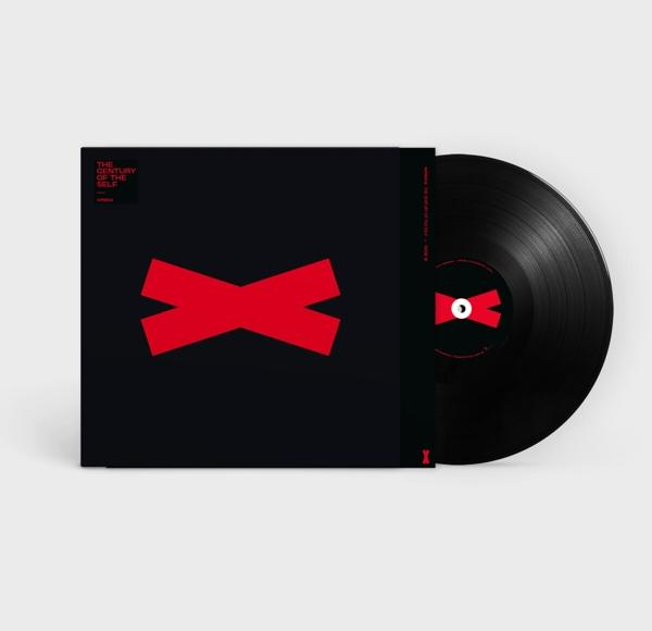 Vinil lemez fekete borítóban, piros kereszt mintával.