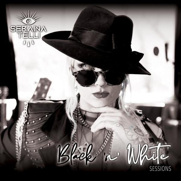 Albumcover: Schwarz-Weiß-Foto einer Frau mit Sonnenbrille und Hut.