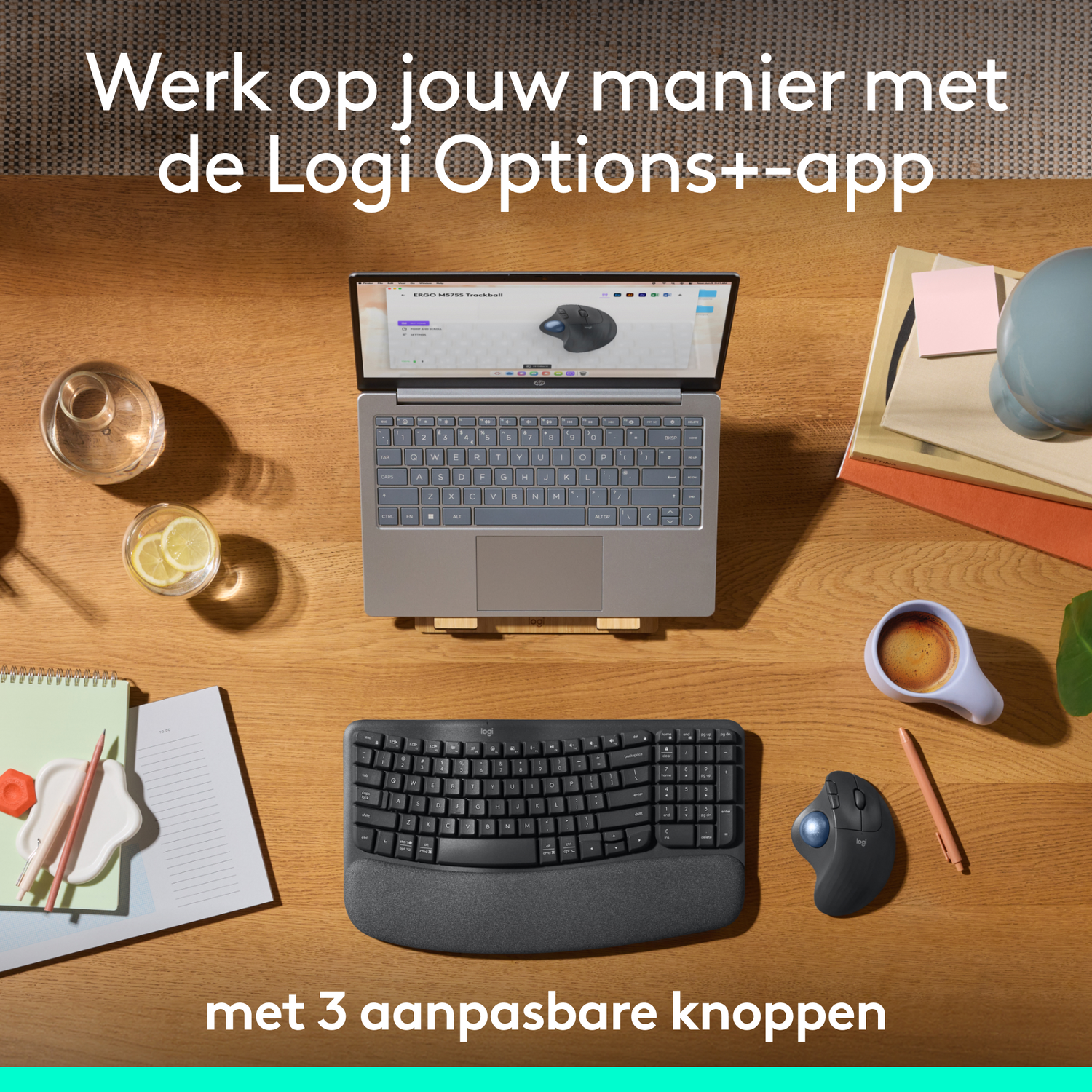 Workspace with laptop, keyboard, mouse, and other accessories on a wooden table.