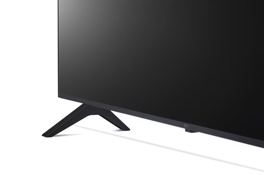 Közelkép a TV lábáról és képernyőjéről. Fekete TV fehér háttérrel.