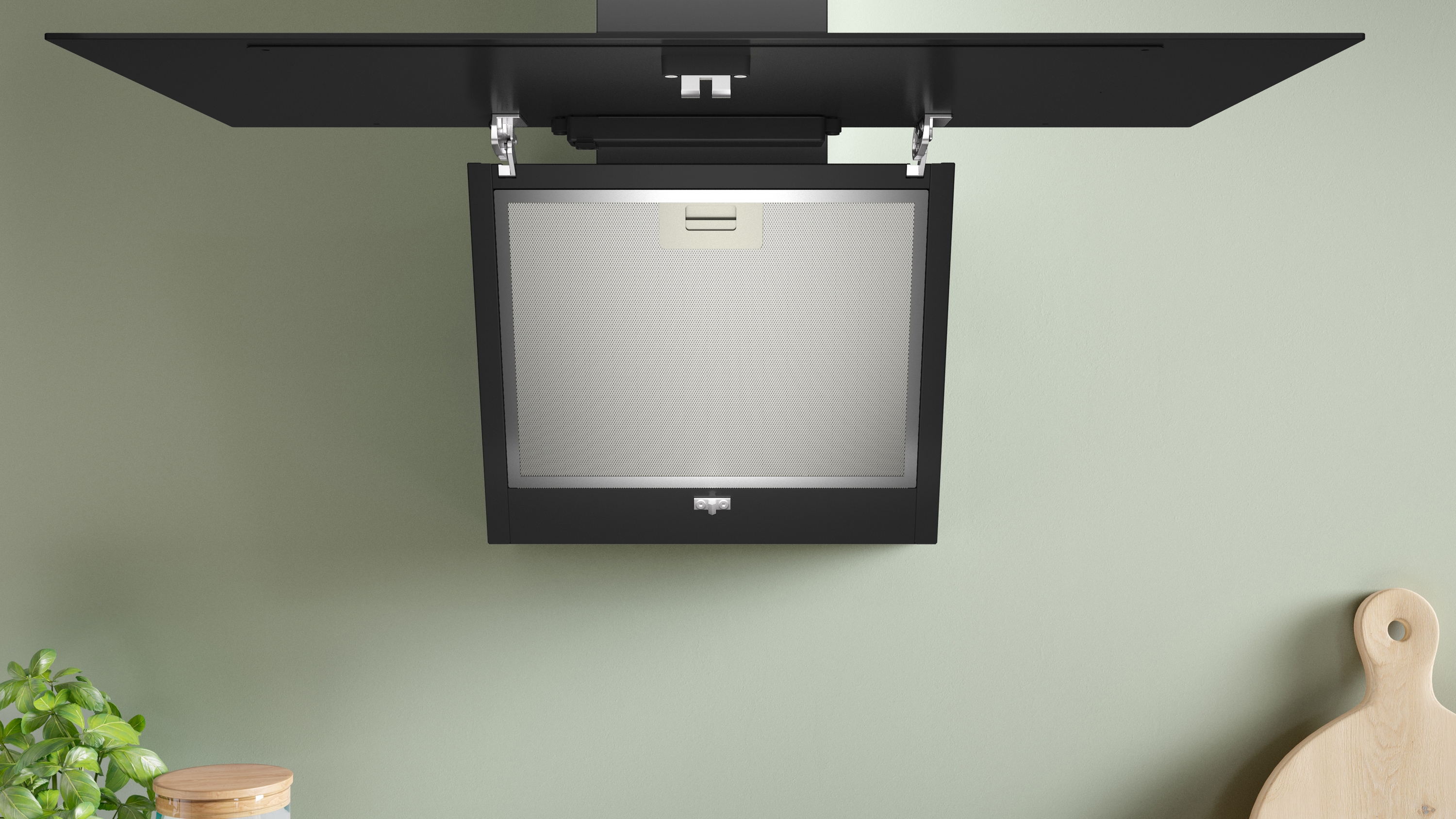 Eine schwarze Küchenhaube ist an der Wand montiert. Sie hat eine rechteckige Form mit einem Netzfilter und einem Licht.
