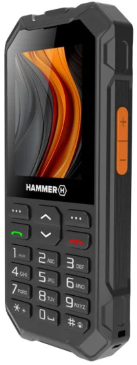 Czarny, wytrzymały telefon z klawiaturą numeryczną i pomarańczowymi przyciskami.