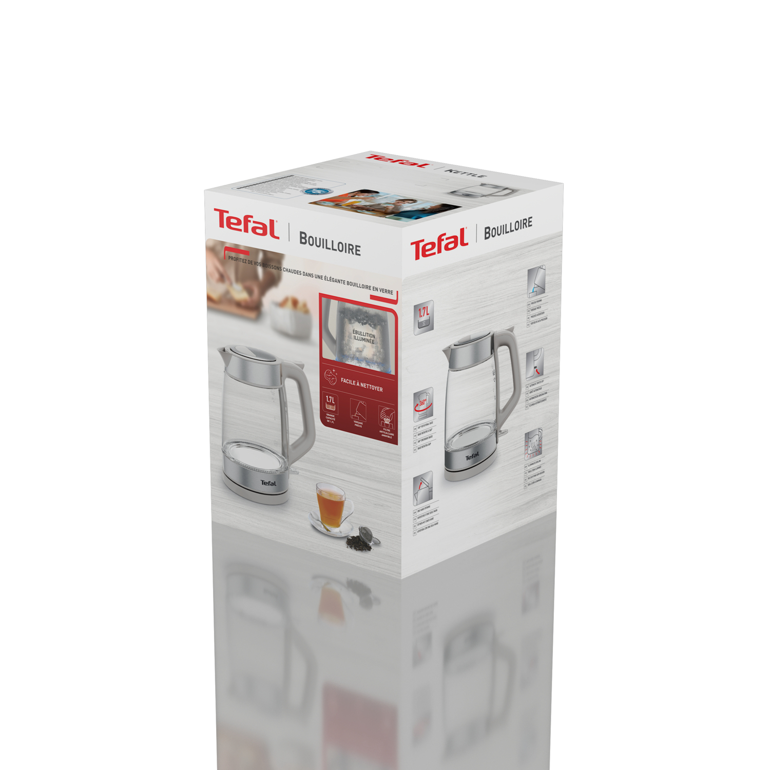 Boxed electric kettle on a reflective surface.