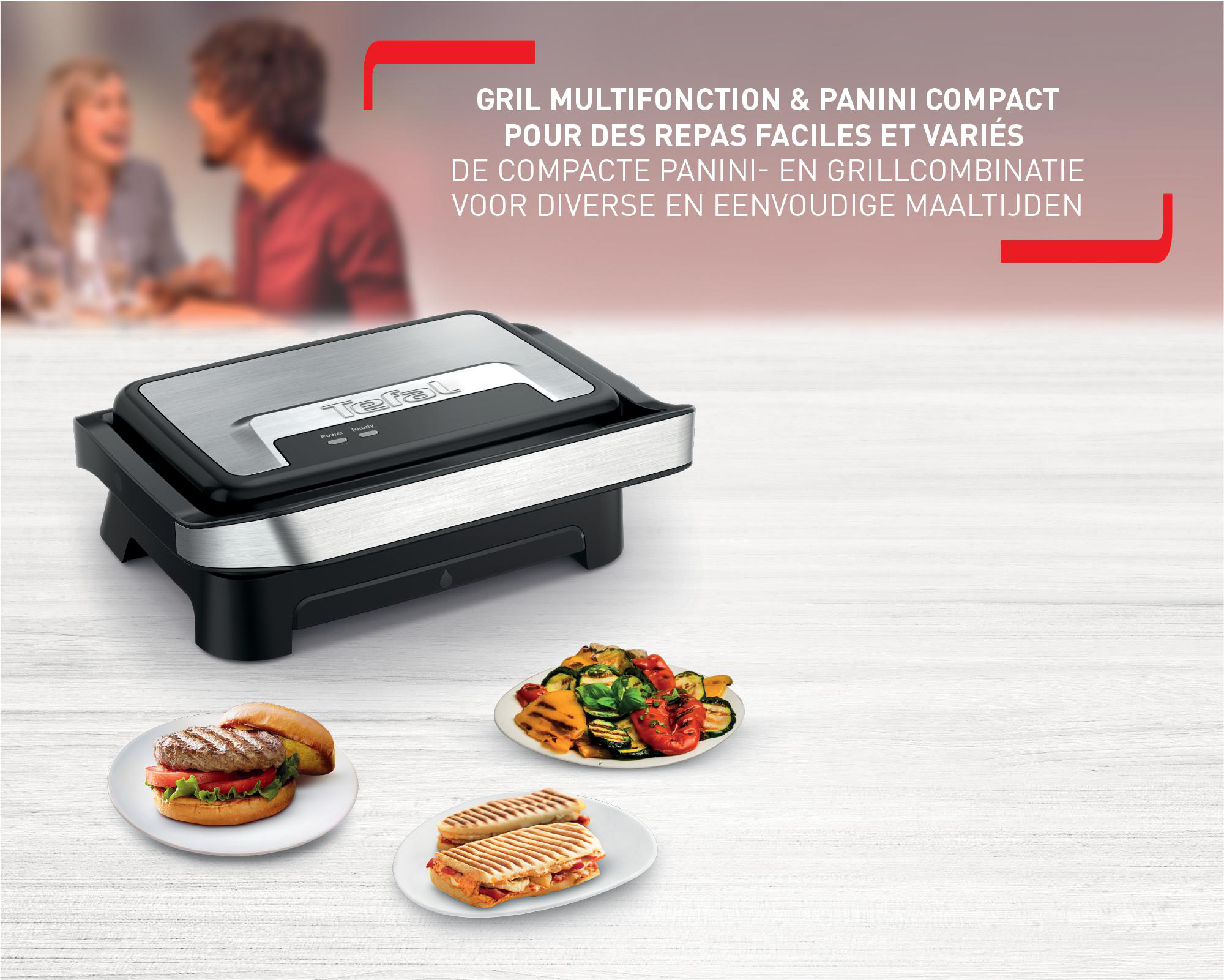 Ein kompakter Grill- und Panini-Maker mit Essen auf Tellern: Burger, gegrilltes Gemüse und Panini.