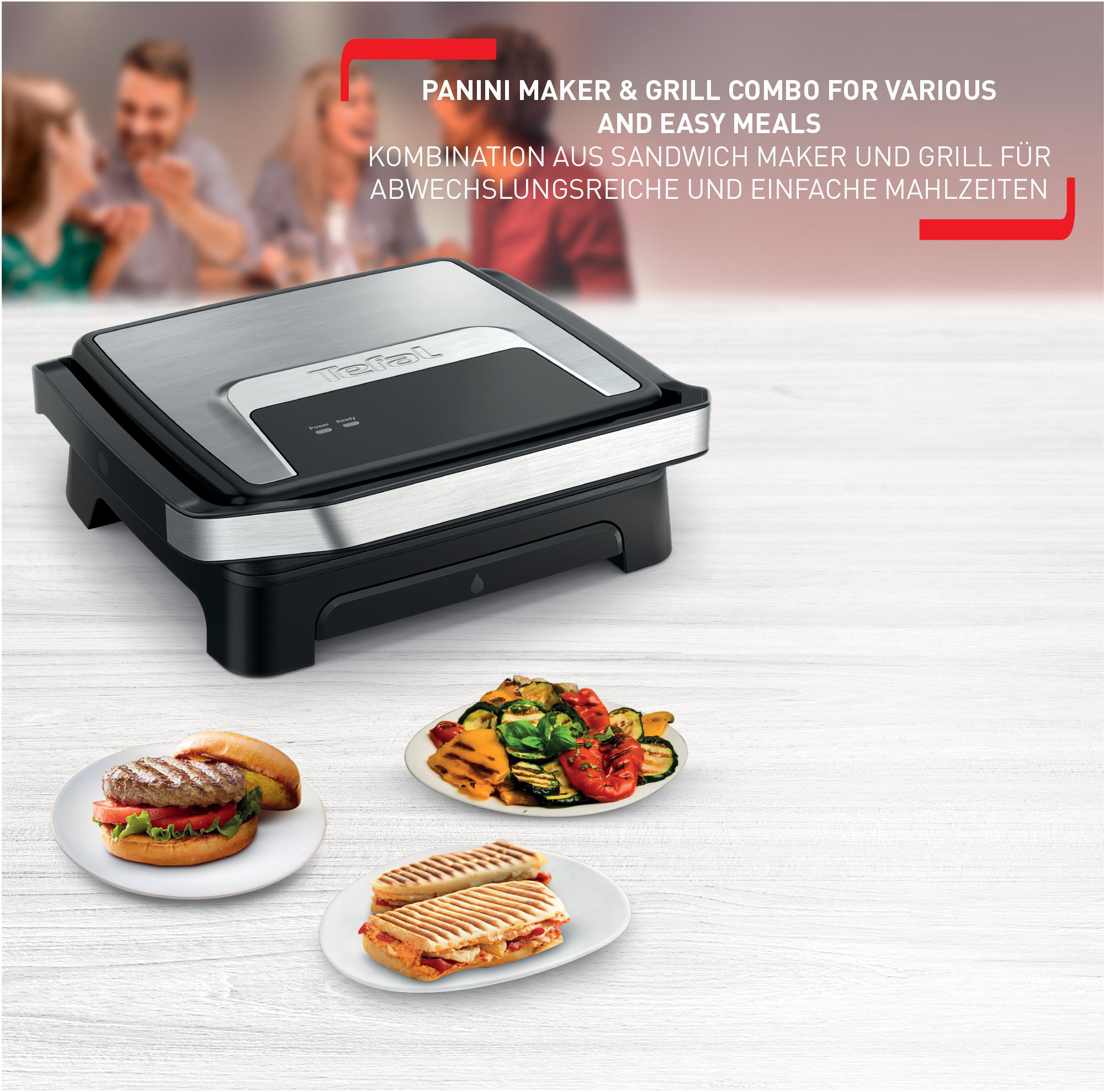 Ein Panini-Maker mit Burger, gegrilltem Gemüse und Panini auf Tellern.