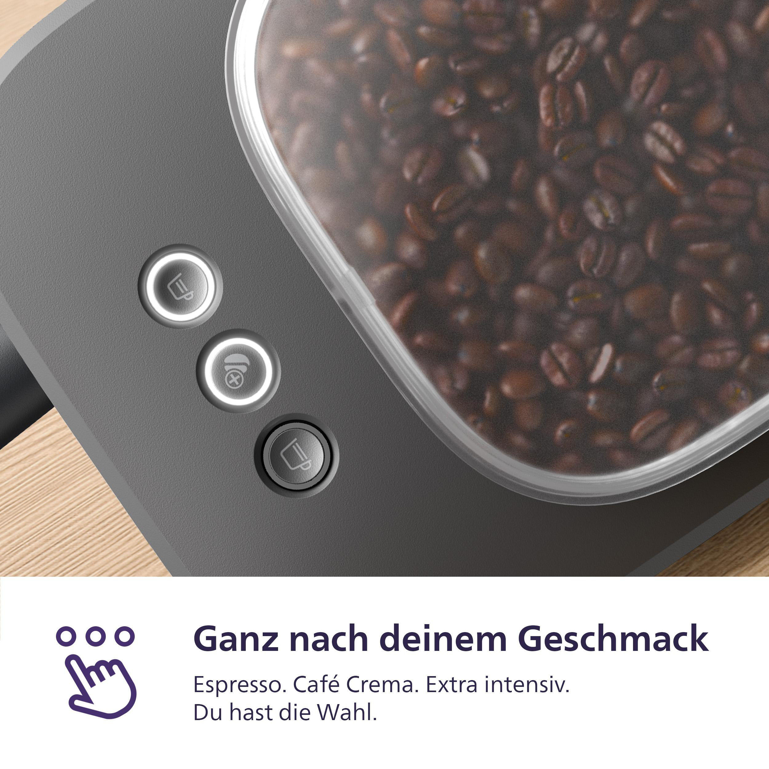 Nahaufnahme einer Kaffeemaschine mit Kaffeebohnen und Knöpfen. Graue Maschine, weiße Lichter.