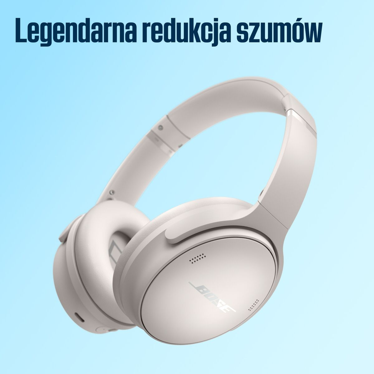 Beżowe słuchawki marki Bose. Jasnoniebieskie tło, tekst: "Legendarna redukcja szumów".