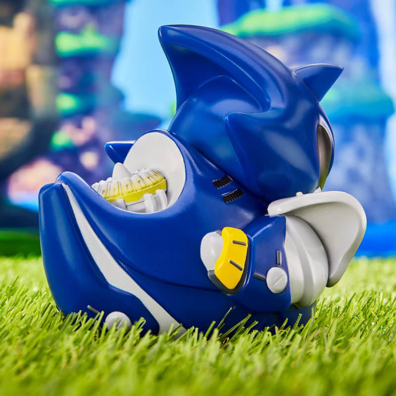 Sonic the Hedgehog játék. Kék és fehér, sárga szájjal. Zöld füvön.
