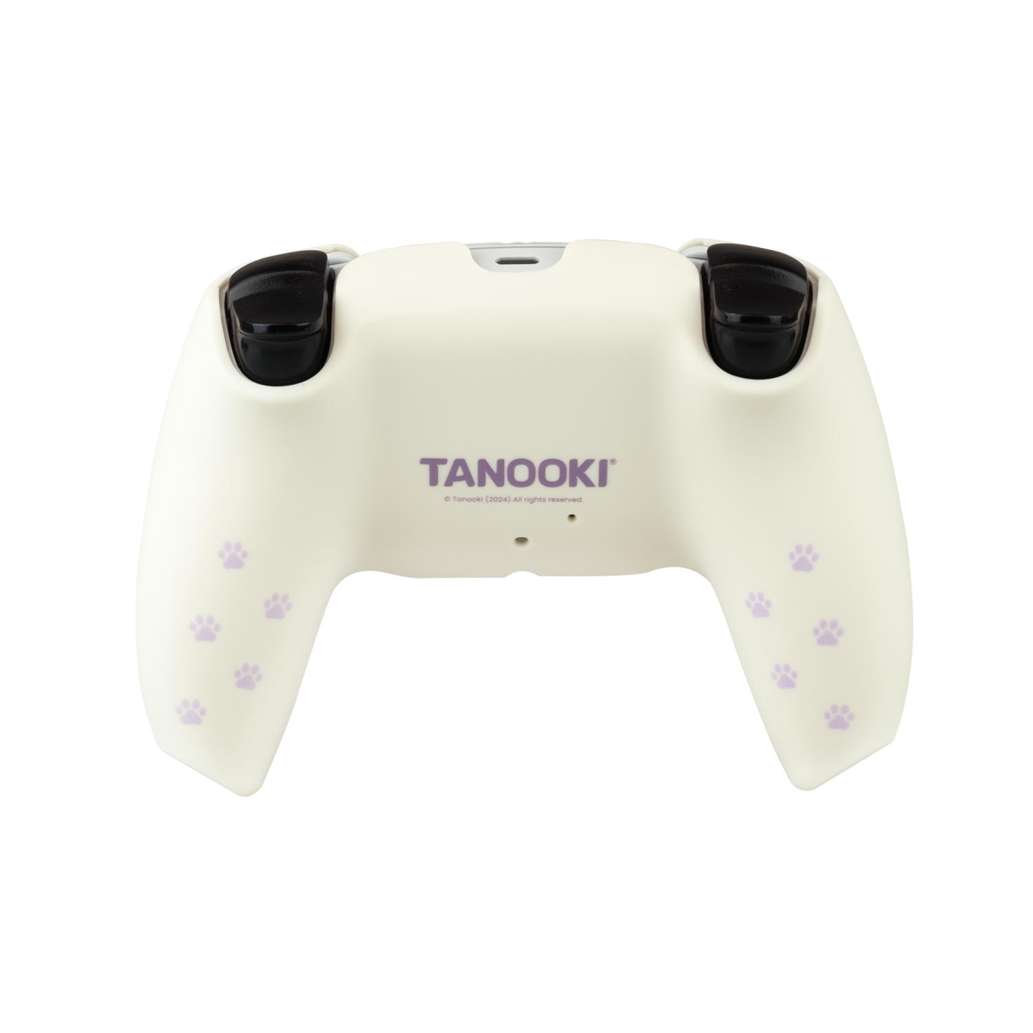 Un mando de juegos blanco con huellas de patas moradas y la palabra 'TANOOKI'. Joysticks negros arriba.