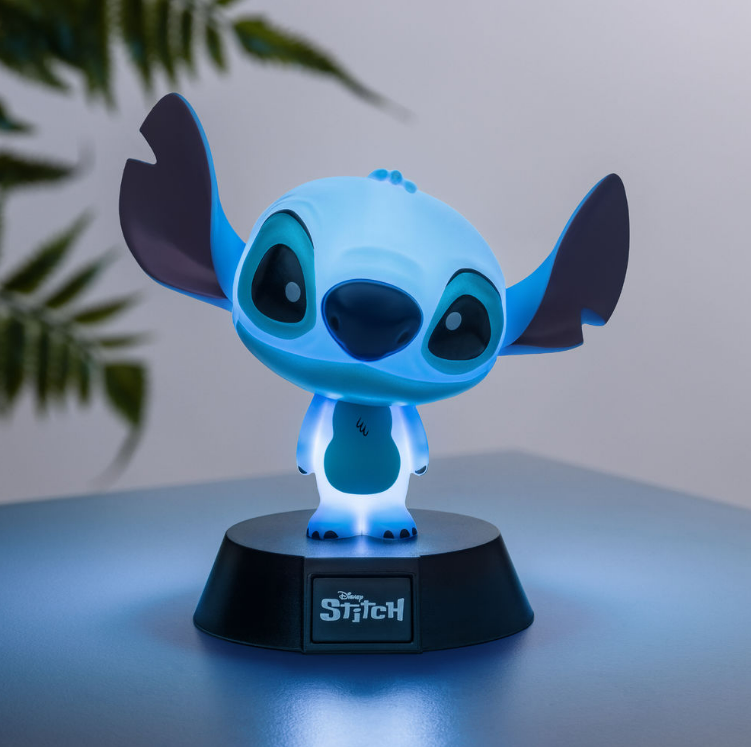 Stitch-Charakter-Lampe mit blauem Leuchten. Schwarze Basis, große Ohren und große Augen.