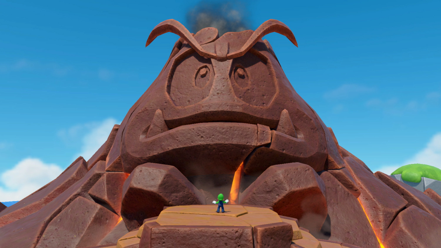 A large stone statue of a turtle-like creature, with a small green figure standing in front.
