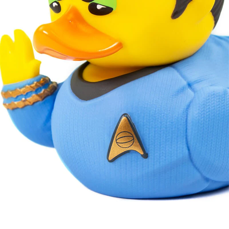 Egy gumikacsa Star Trek egyenruhában, sárga fejjel és narancssárga csőrrel.
